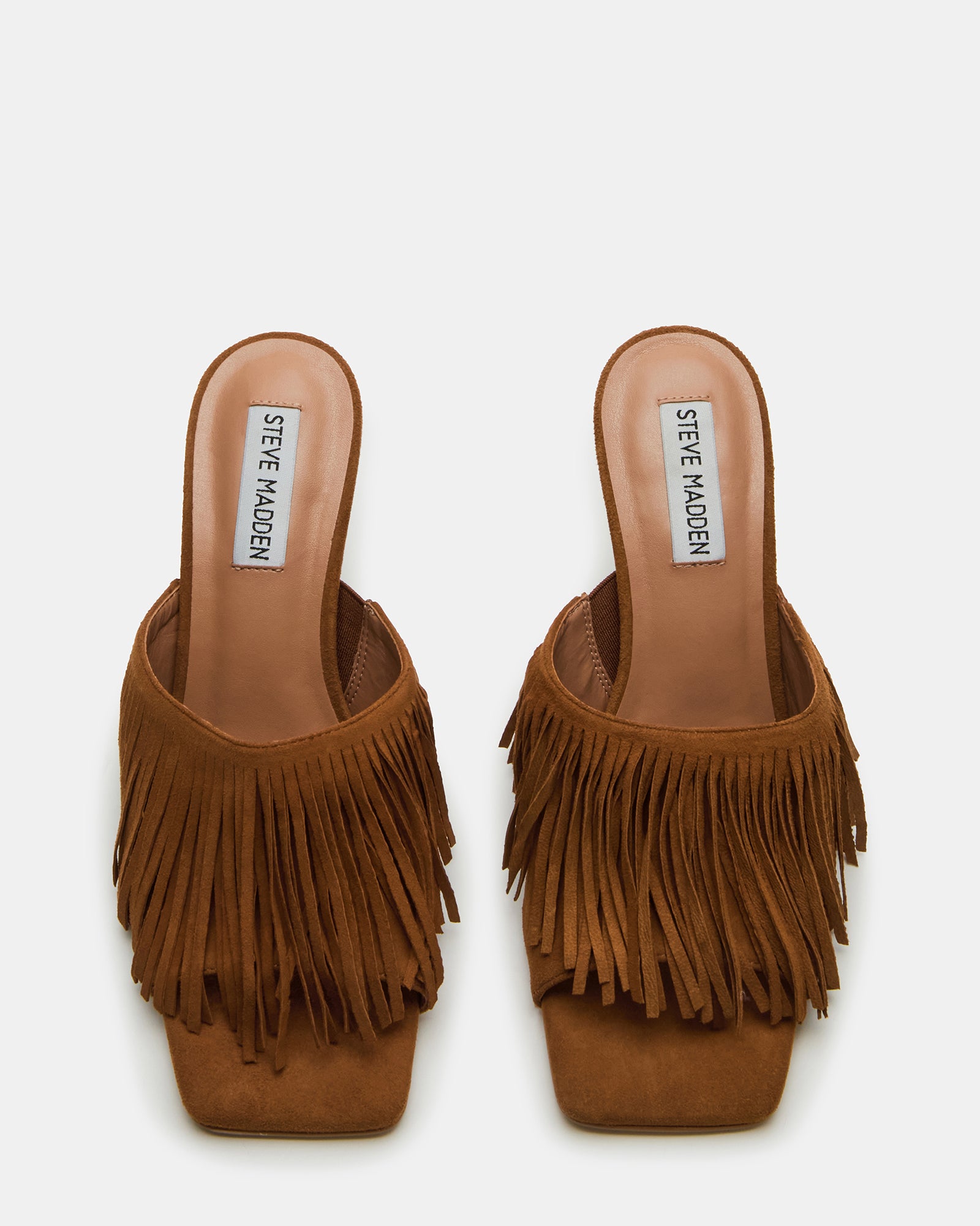 Side view of cognac mule with stiletto heel and fringe detailing