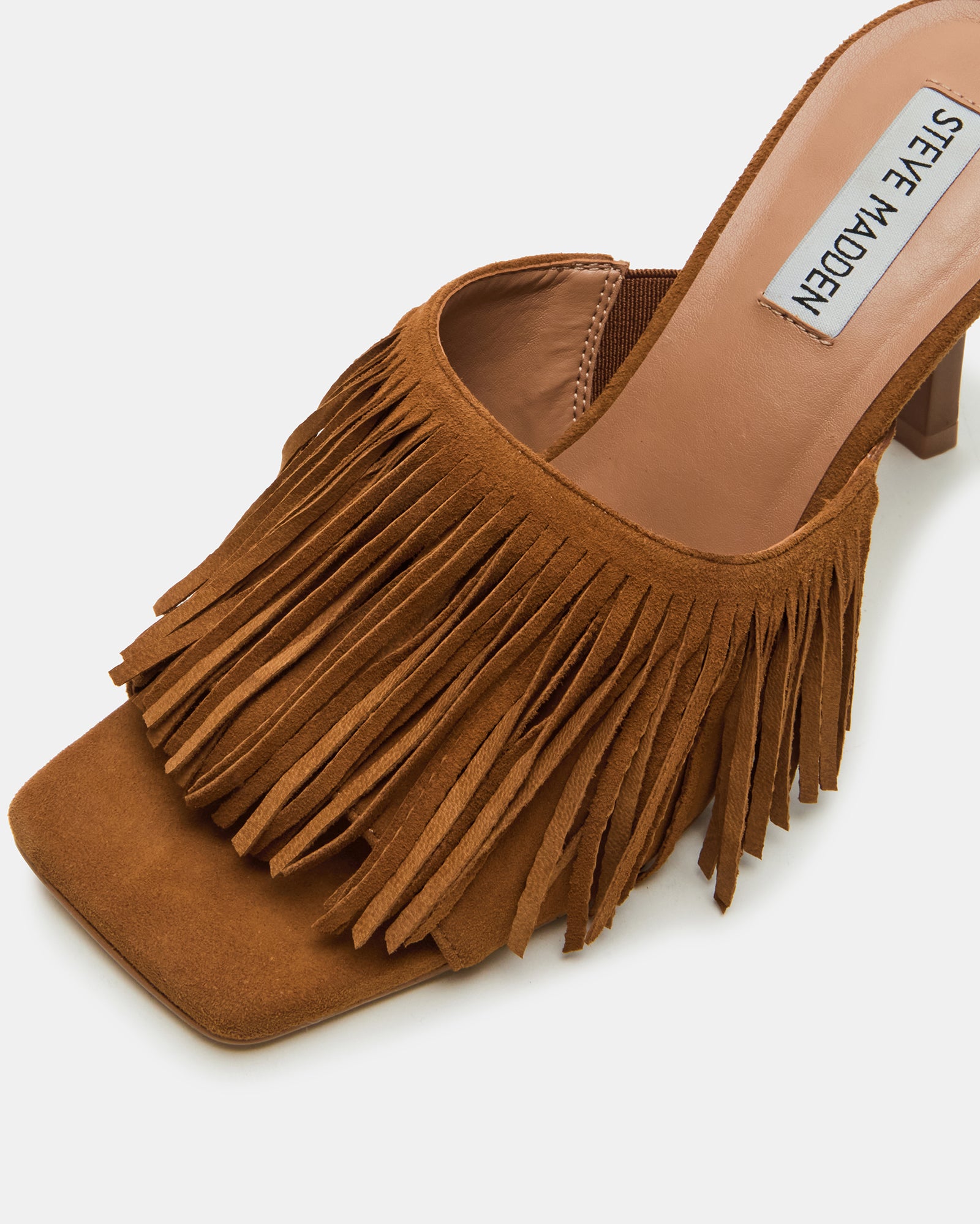Lifestyle photo featuring Morina gold-toned heels worn on city sidewalk