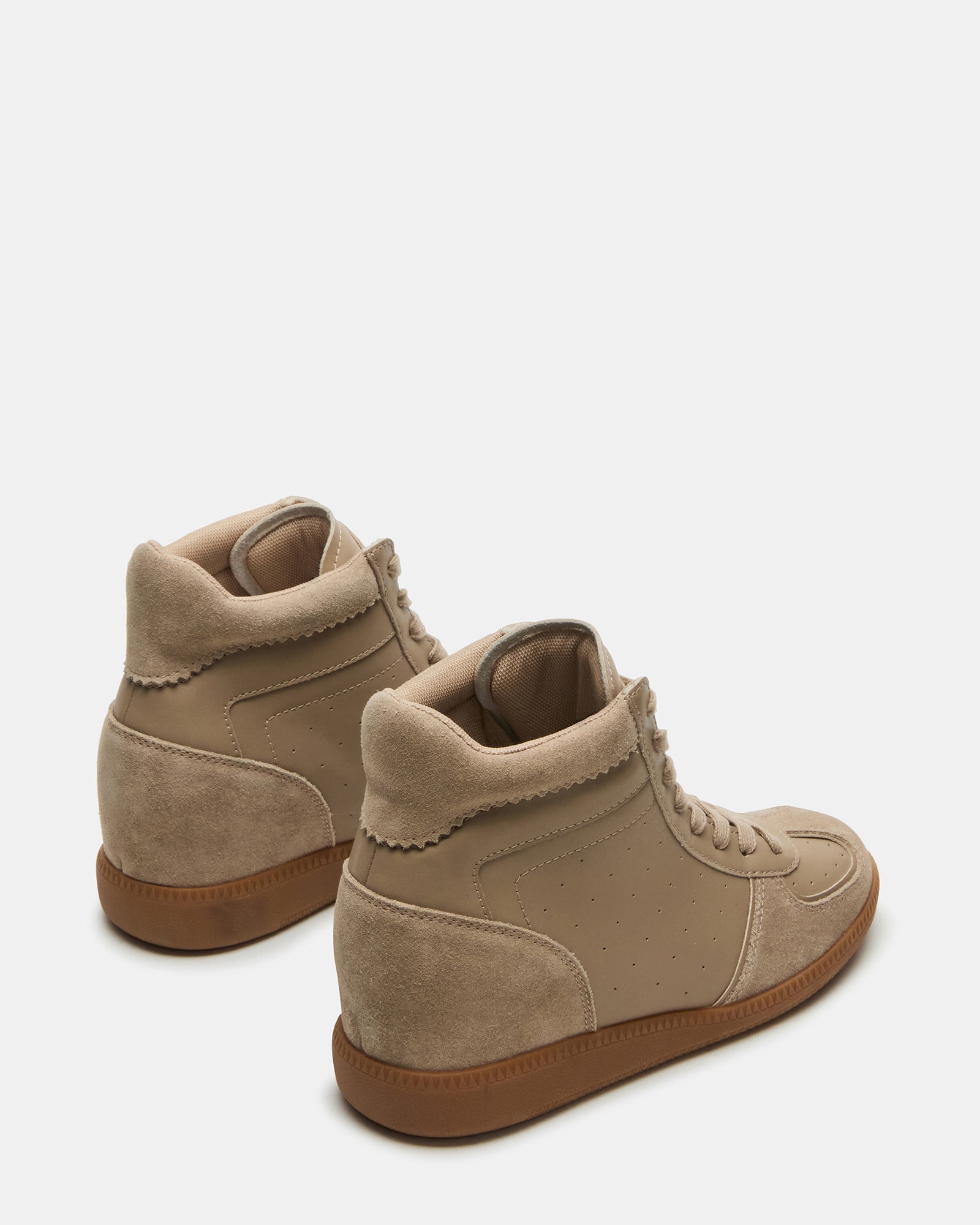 Top-down view of womens black wedge sneakers styled for an urban weekend look