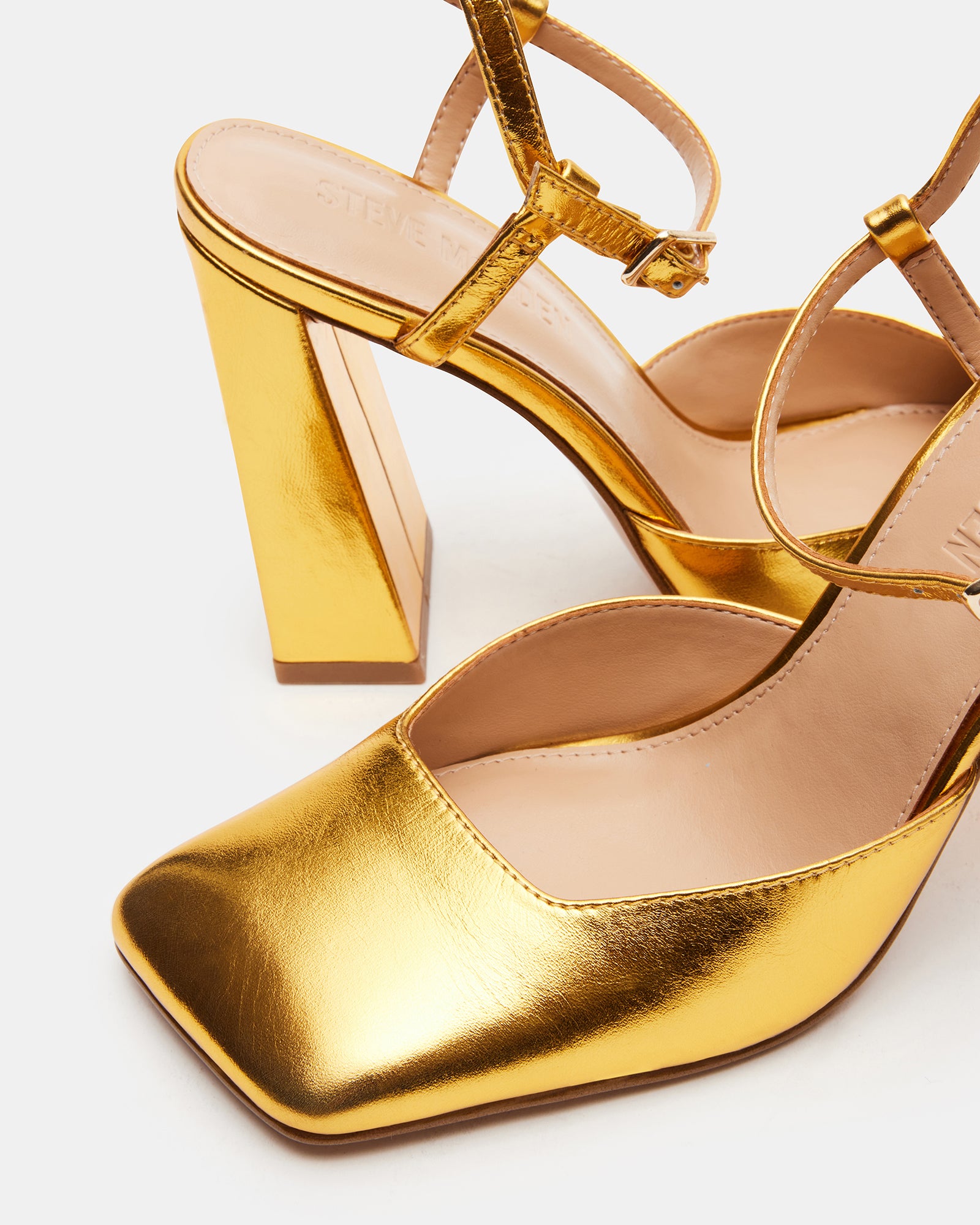 Close-up of Mosaic Gold Square Toe Heels highlighting the square toe design.
