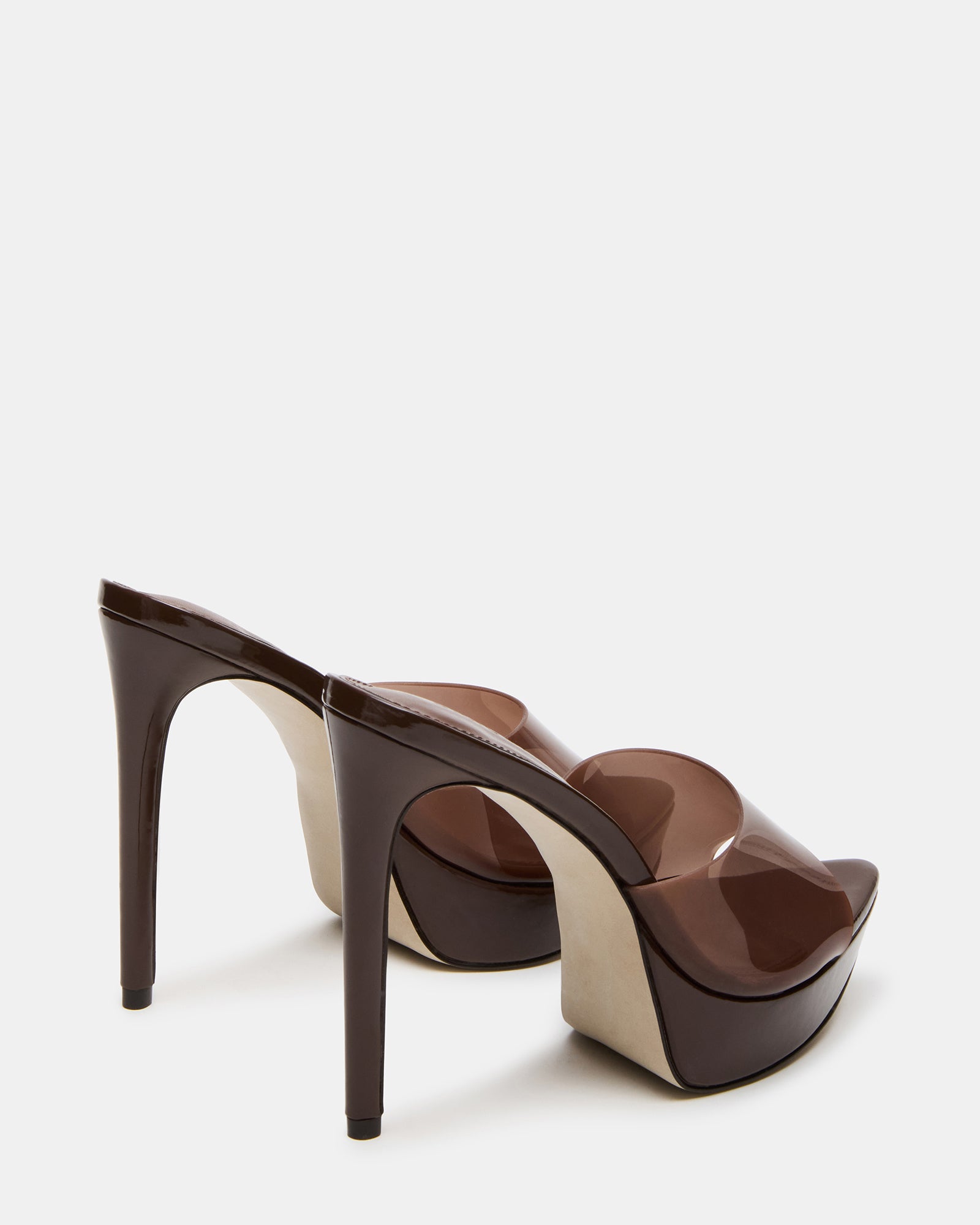 Close-up of the PVC upper material of the brown mule heels.