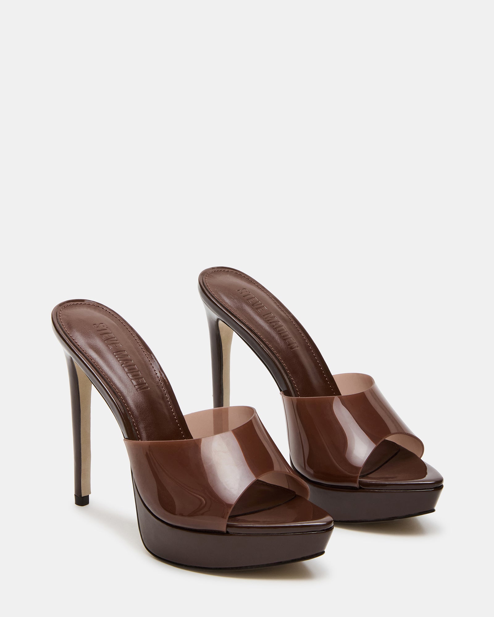 Close-up of the PVC upper material of the brown mule heels.