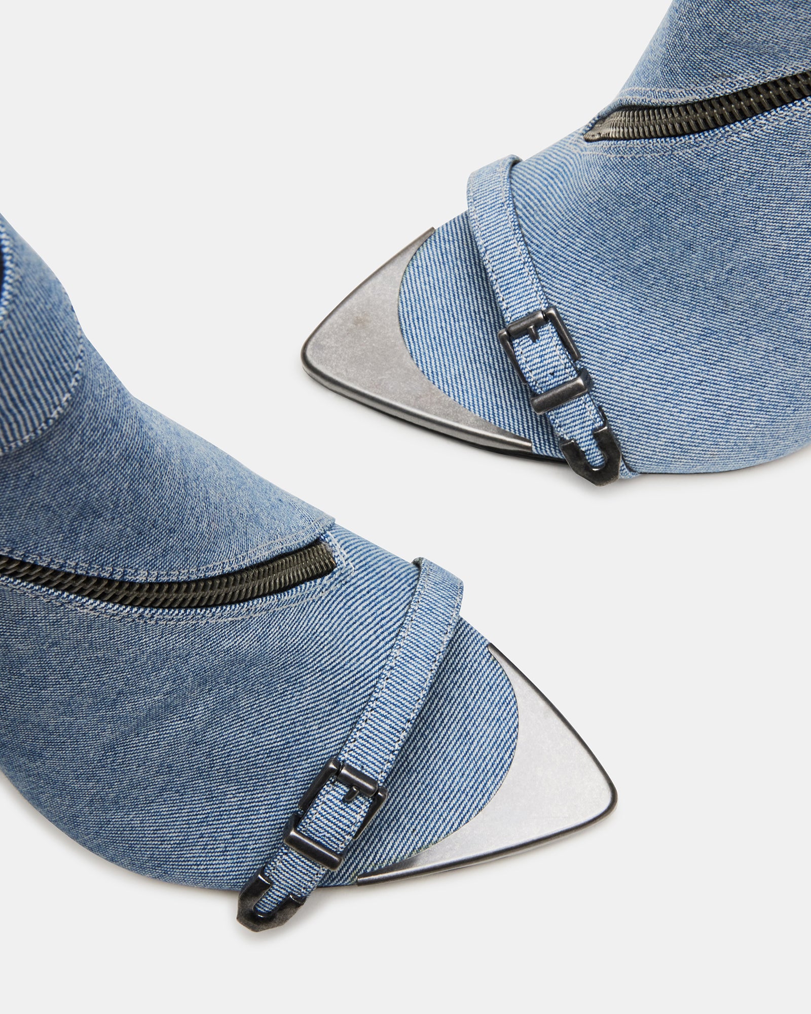 Elegant peep toe ankle booties showcasing stiletto heels in a stylish setting.