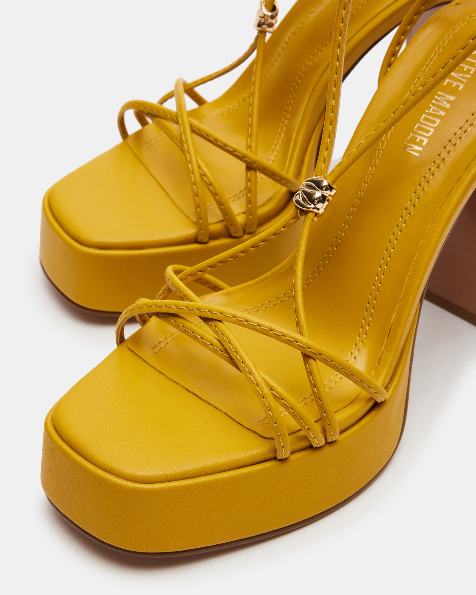 Fashionable view of Moulin Mustard heels paired with chic outfit