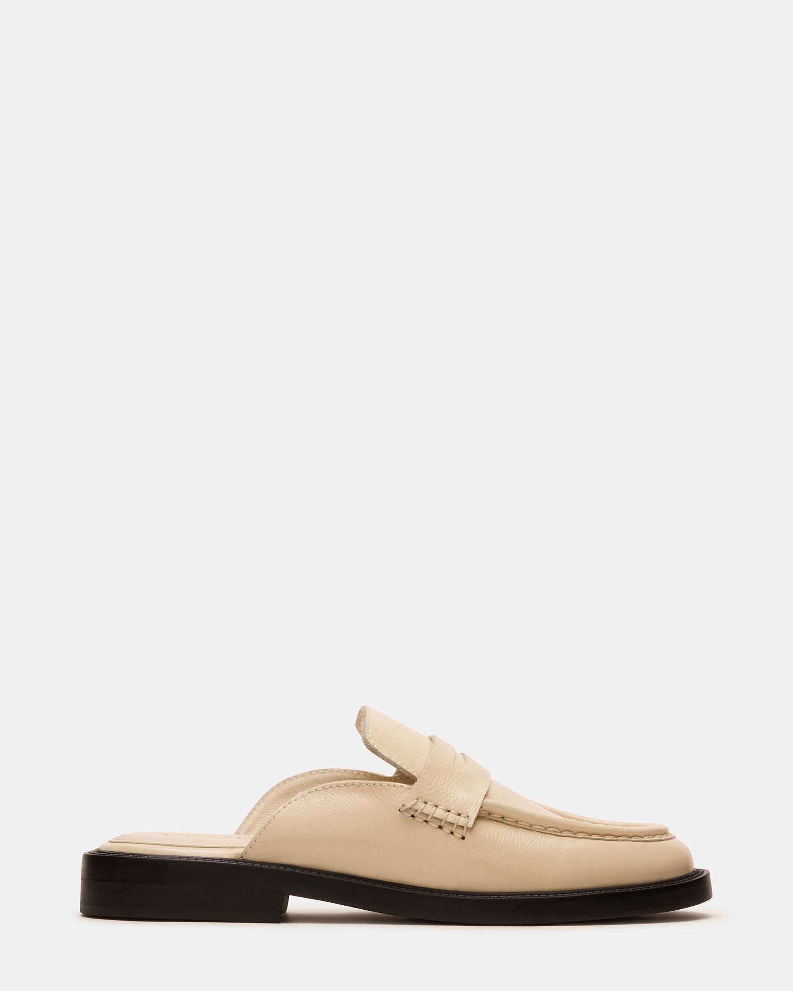 Mulberry women's flat mules in bone leather, styled with casual denim.