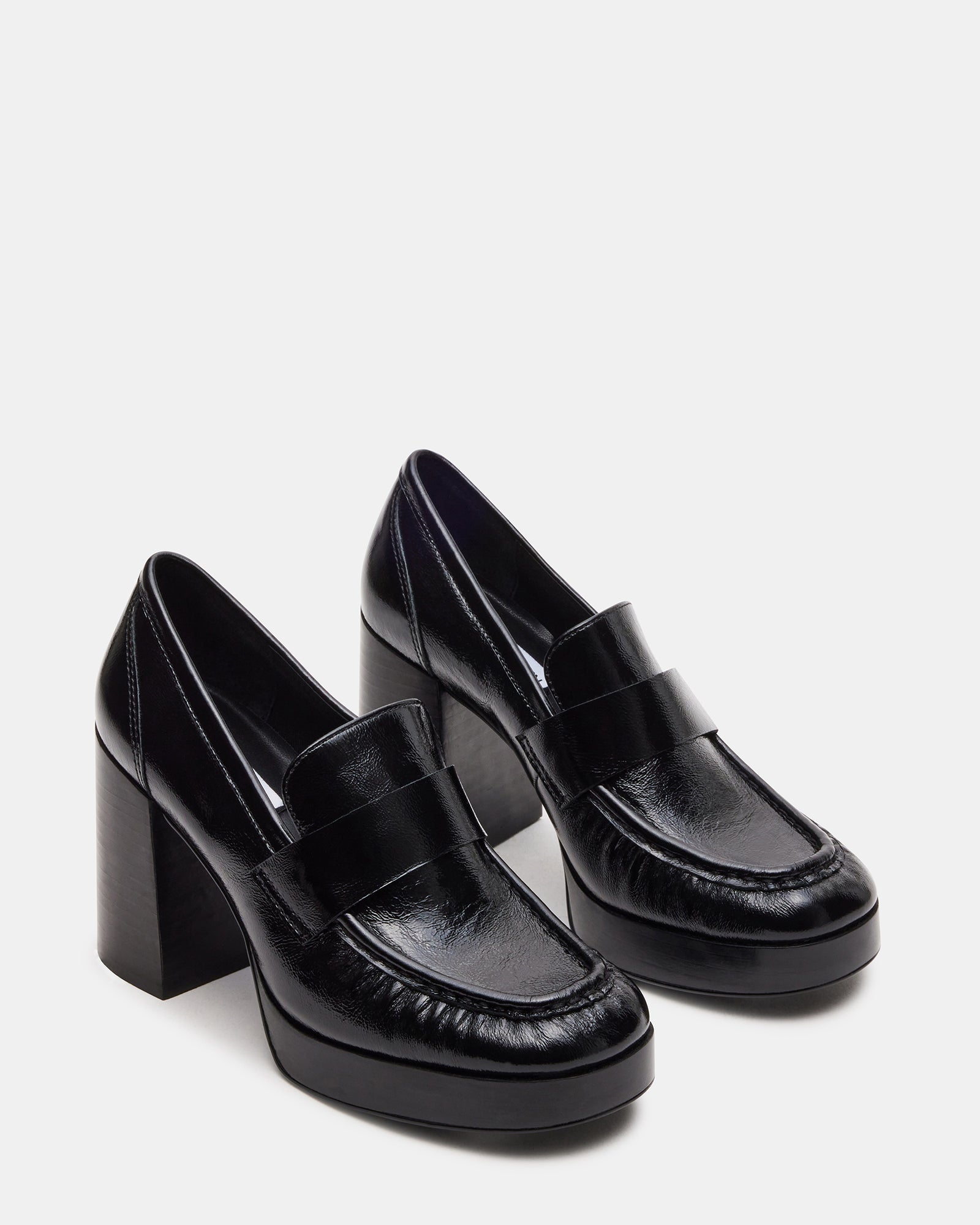 Close-up of the synthetic sole and textured leather upper of loafer loafer loafer