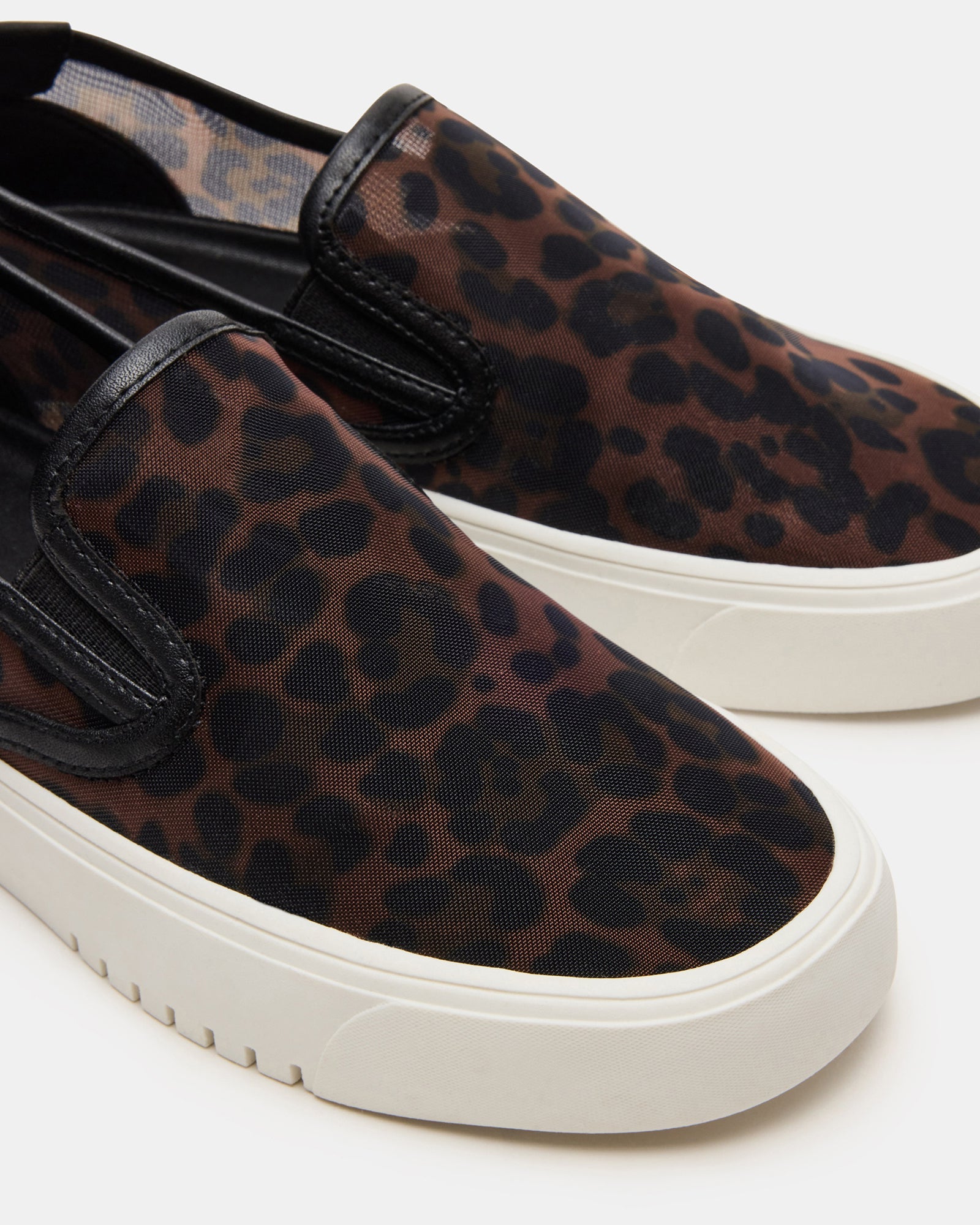 Casual look featuring leopard print sneakers paired with denim