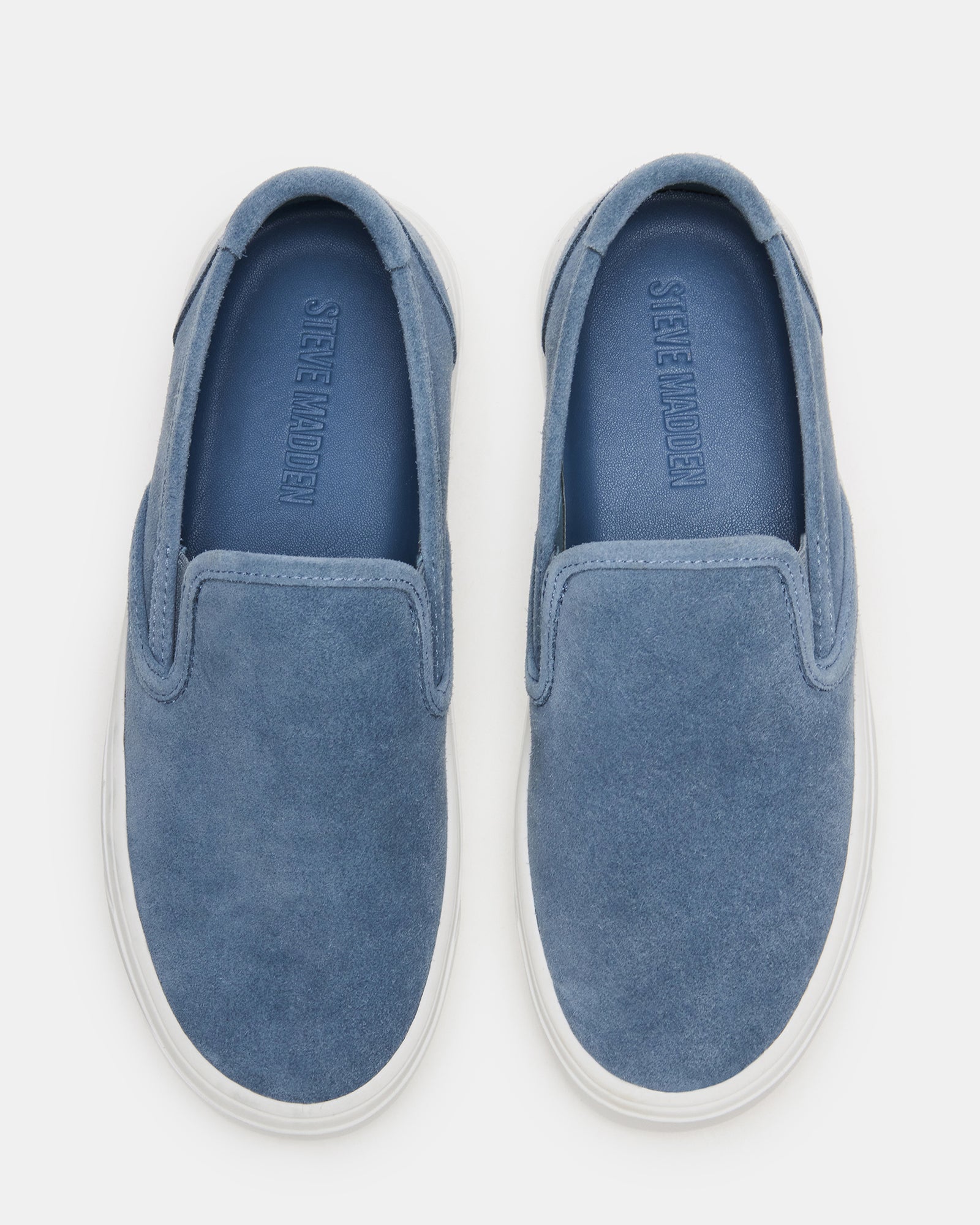 Close-up of mens suede shoes with white sneakers laces and sleek design
