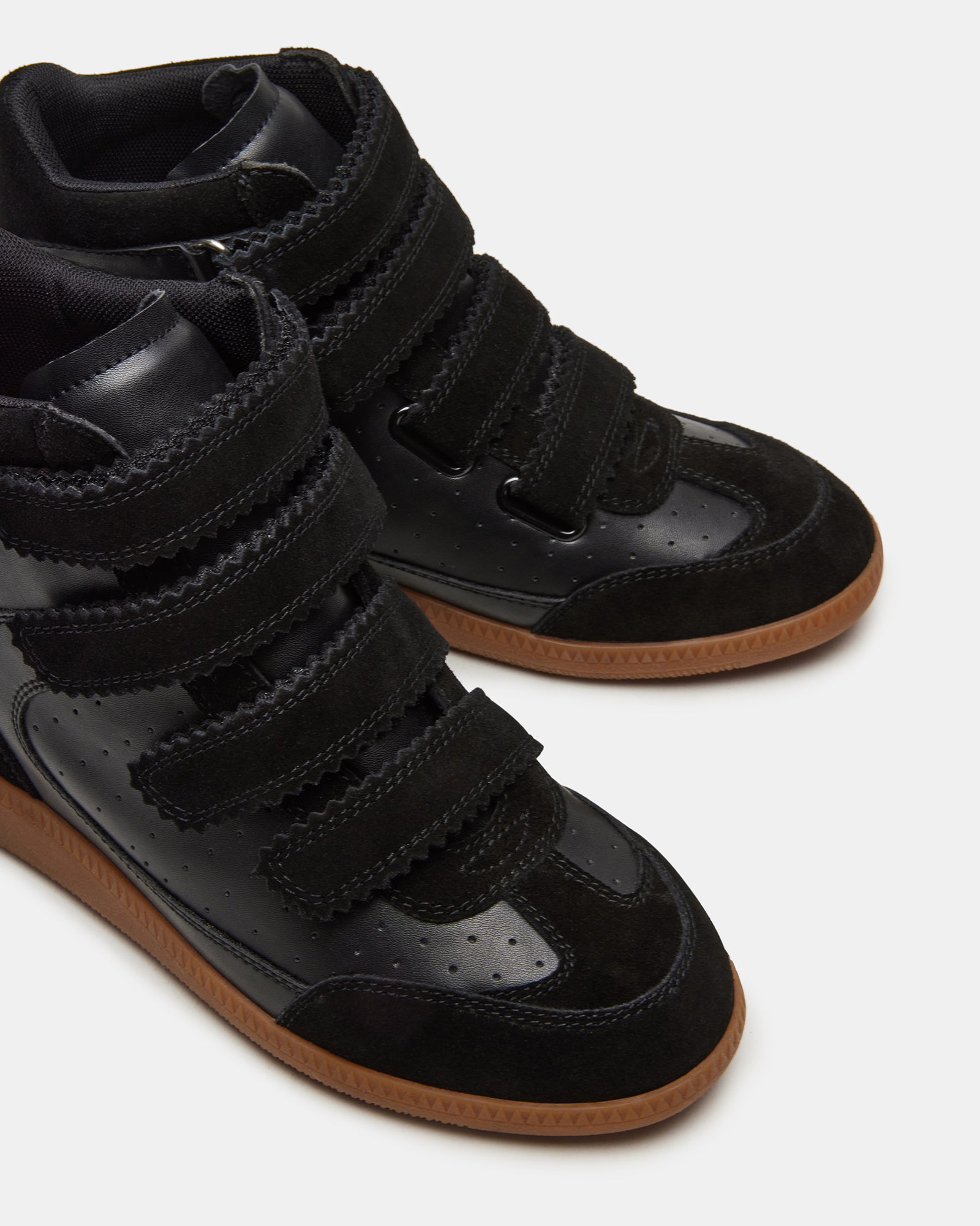Side view of Mustang black suede high-top sneakers showcasing Velcro closure.