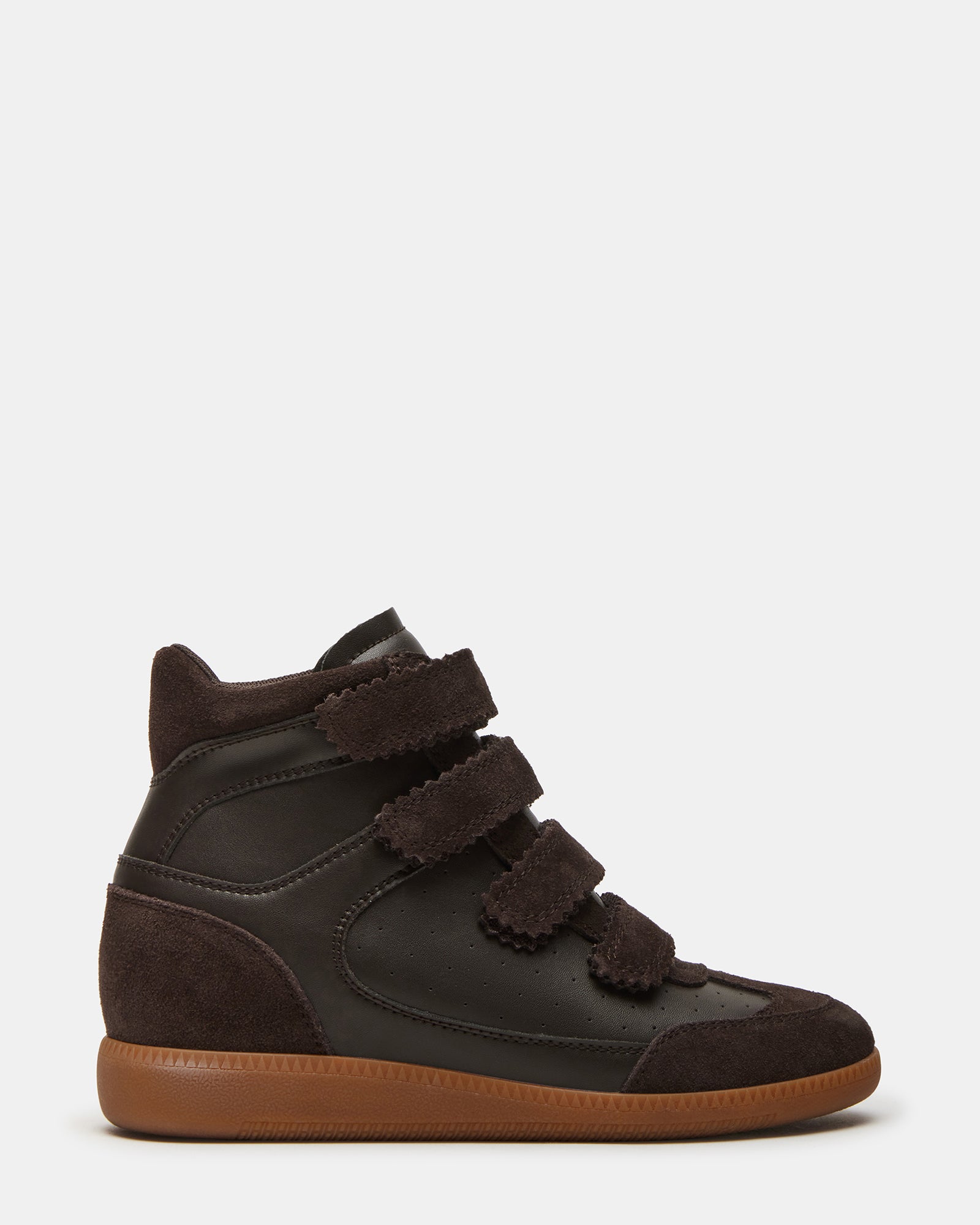 Close-up of Mustang brown suede sneakers showcasing Velcro straps