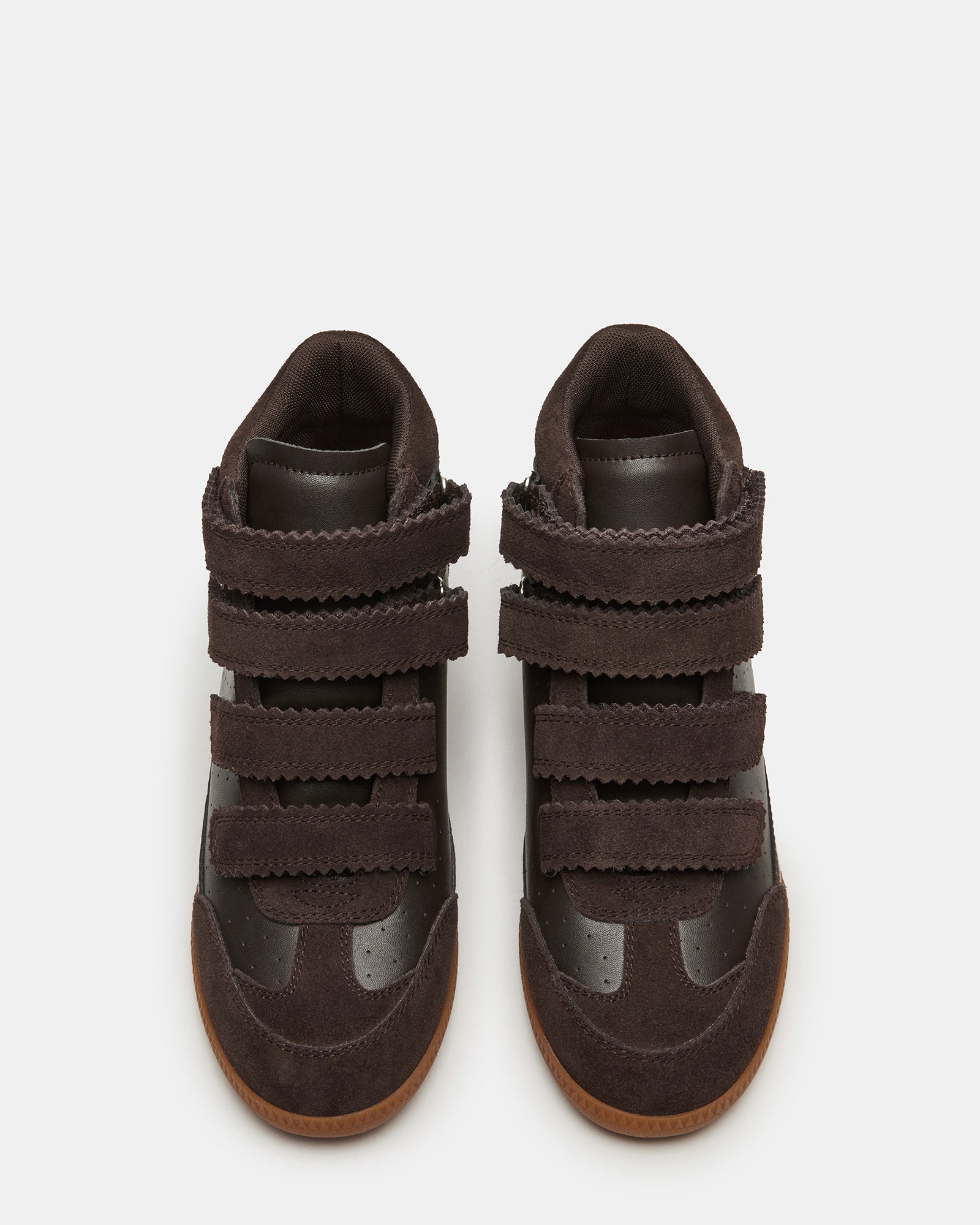 Close-up of Mustang brown suede sneakers showcasing Velcro straps