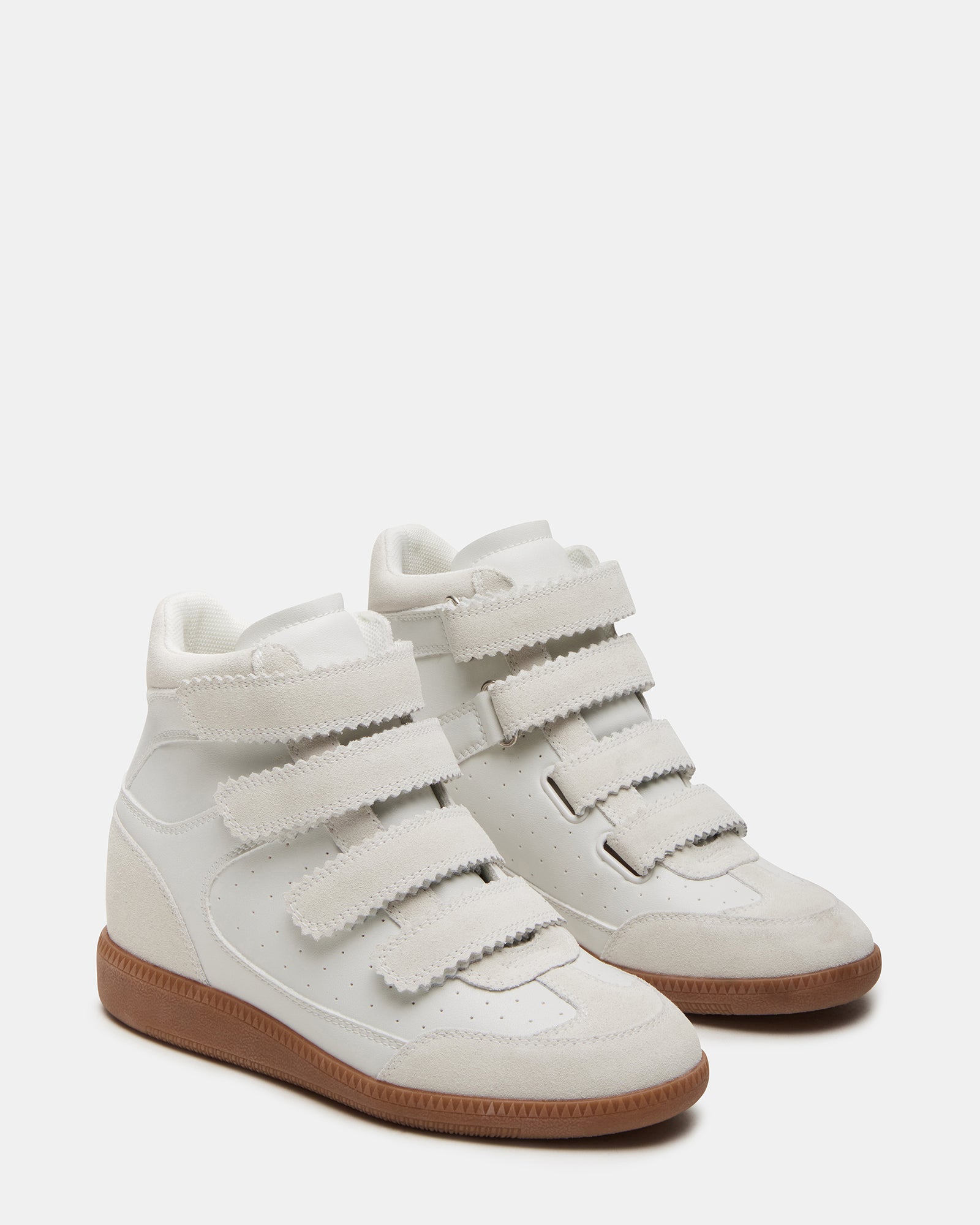 Side view of mens high-top sneakers with Velcro straps in a street style setting