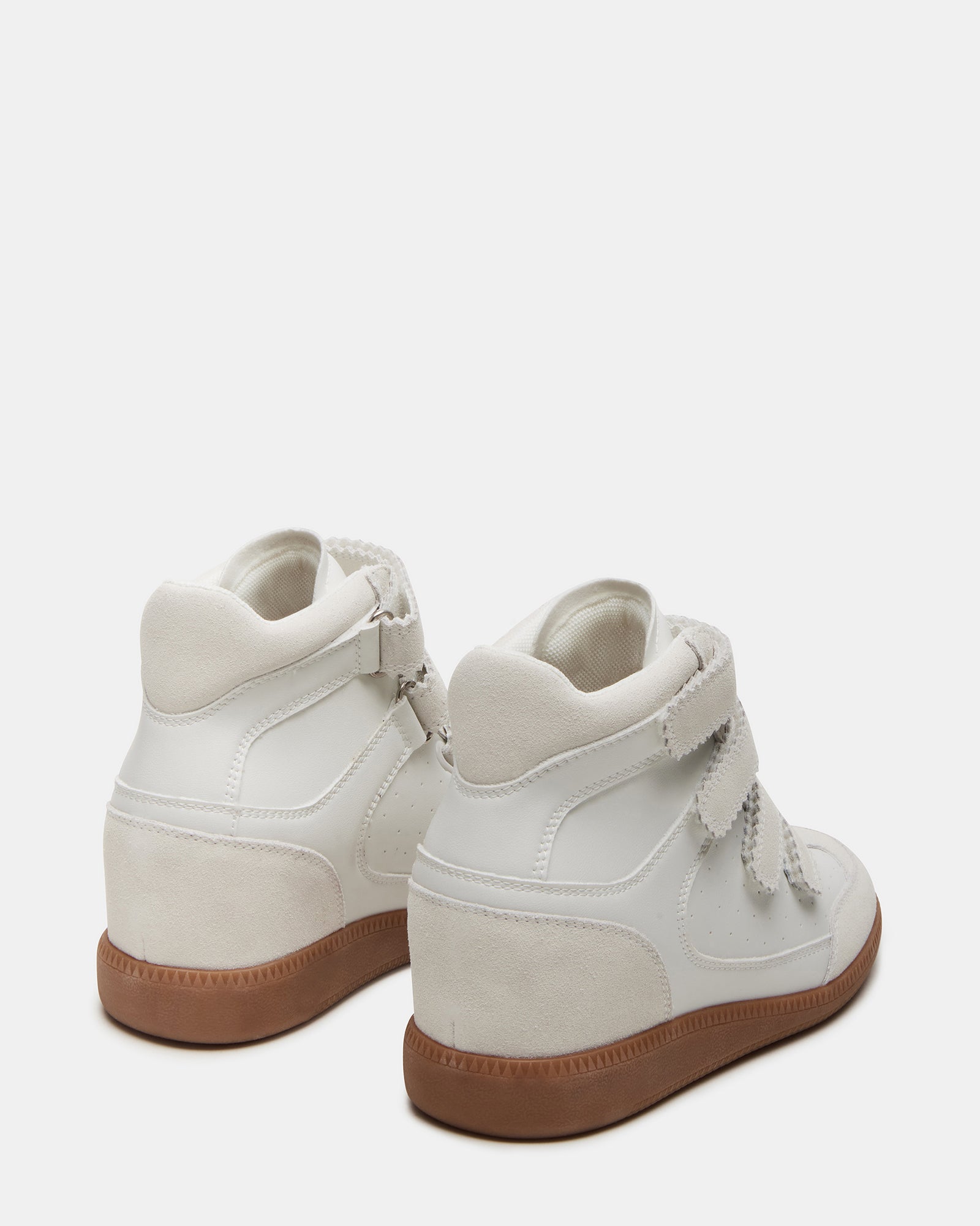 Side view of mens high-top sneakers with Velcro straps in a street style setting