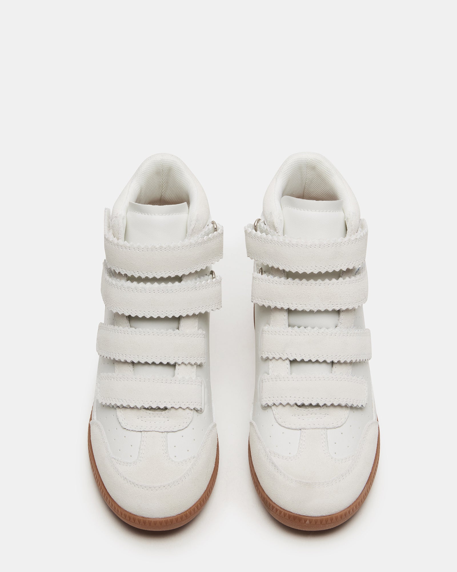 Close-up of white suede high-top Velcro sneakers showing the sleek design