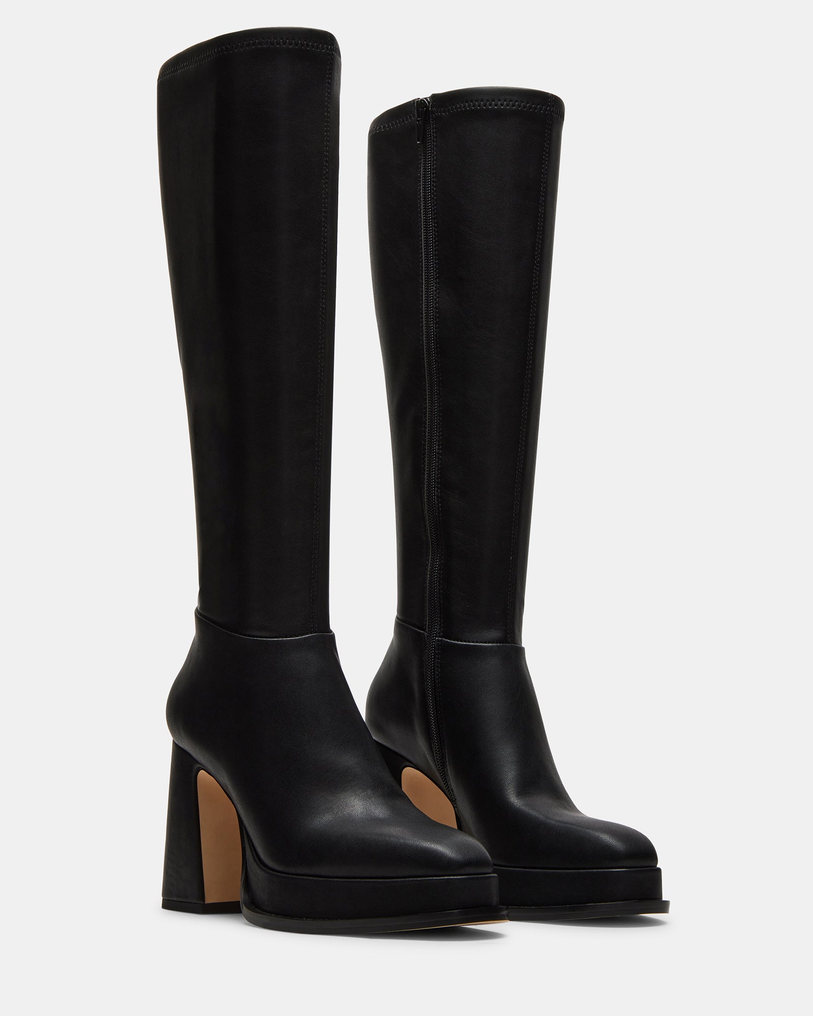 Close-up of the sturdy block heel on Myndie Black boots for added comfort.