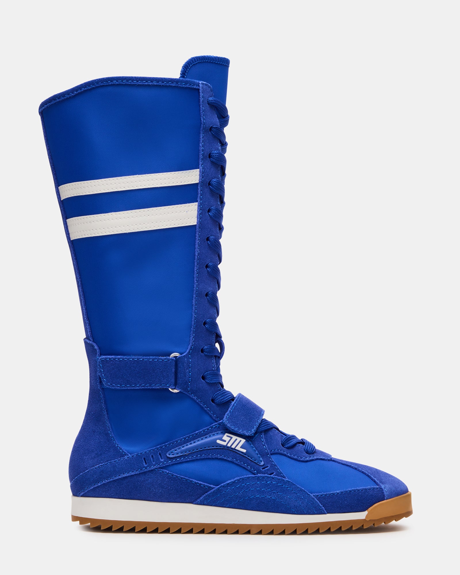 Side view of MYRCELLA Blue Multi high-top sneakers on a woman’s feet, showcasing the stylish design