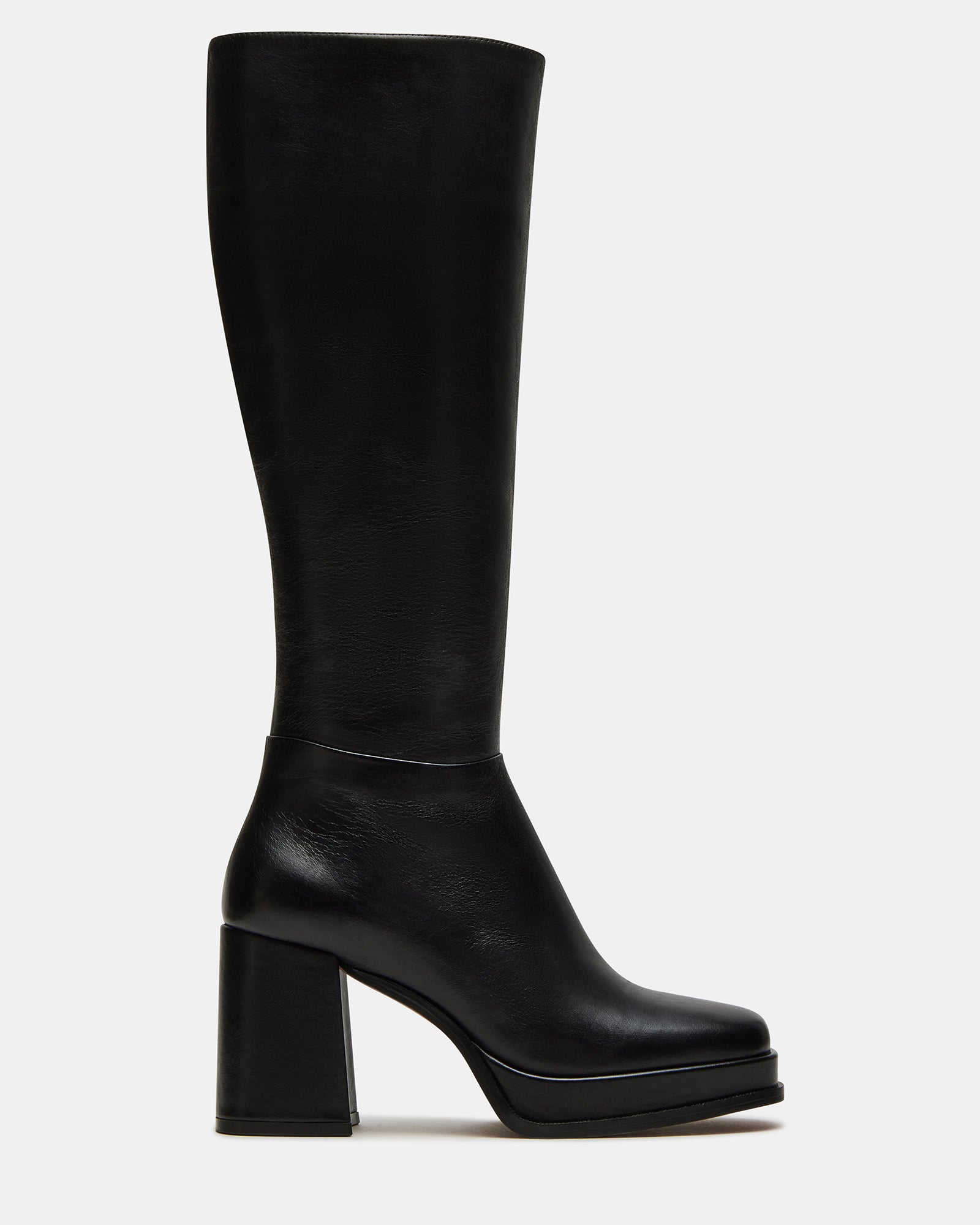 Black leather knee-high boots with square toe and platform heel on a model's foot