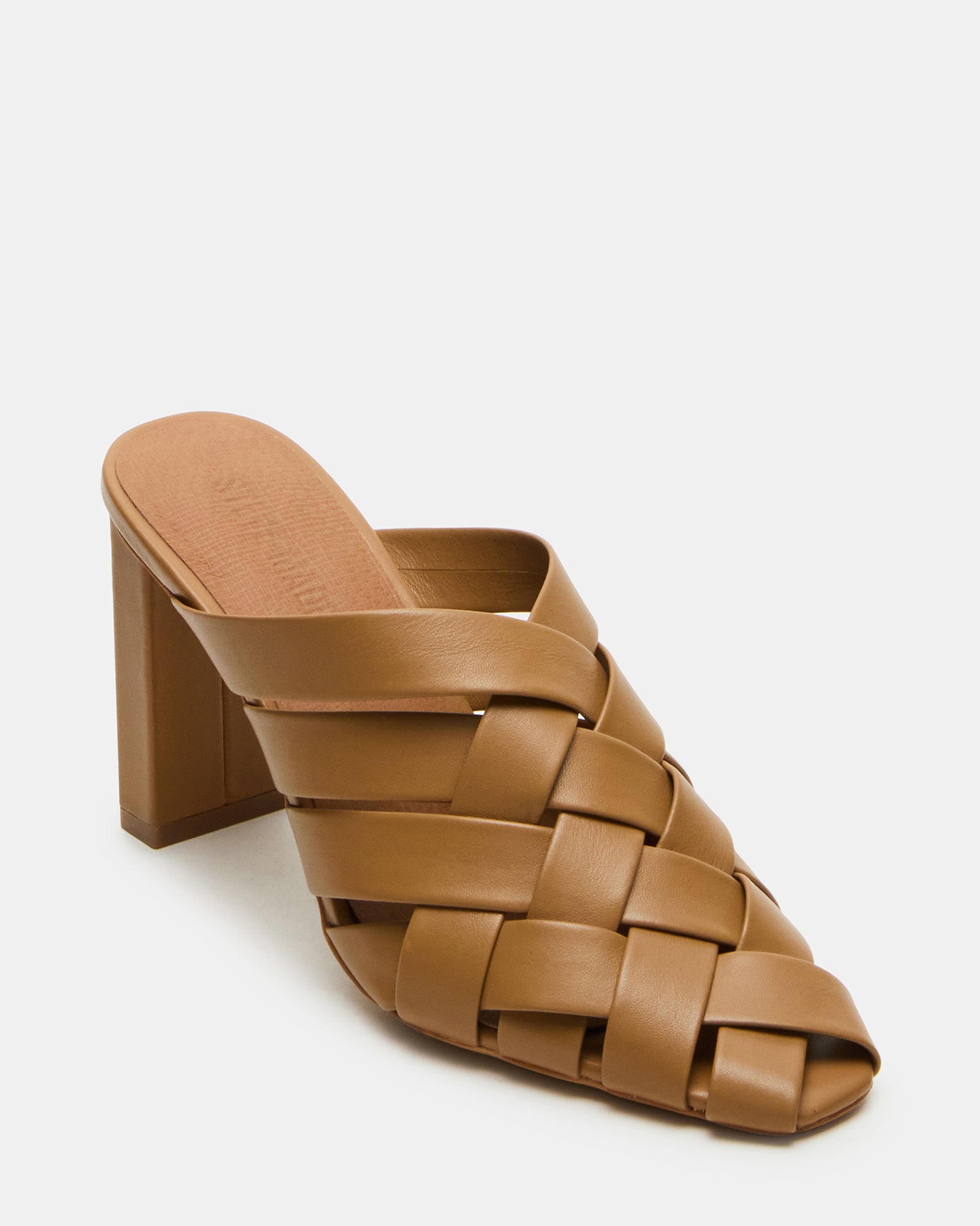 Side angle of kitten heel mules shoes styled with casual denim for daily use