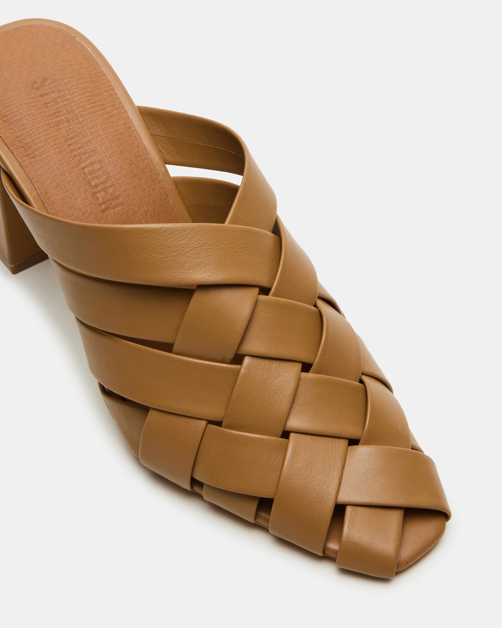 Close-up of square toe kitten heels highlighting synthetic material and craftsmanship