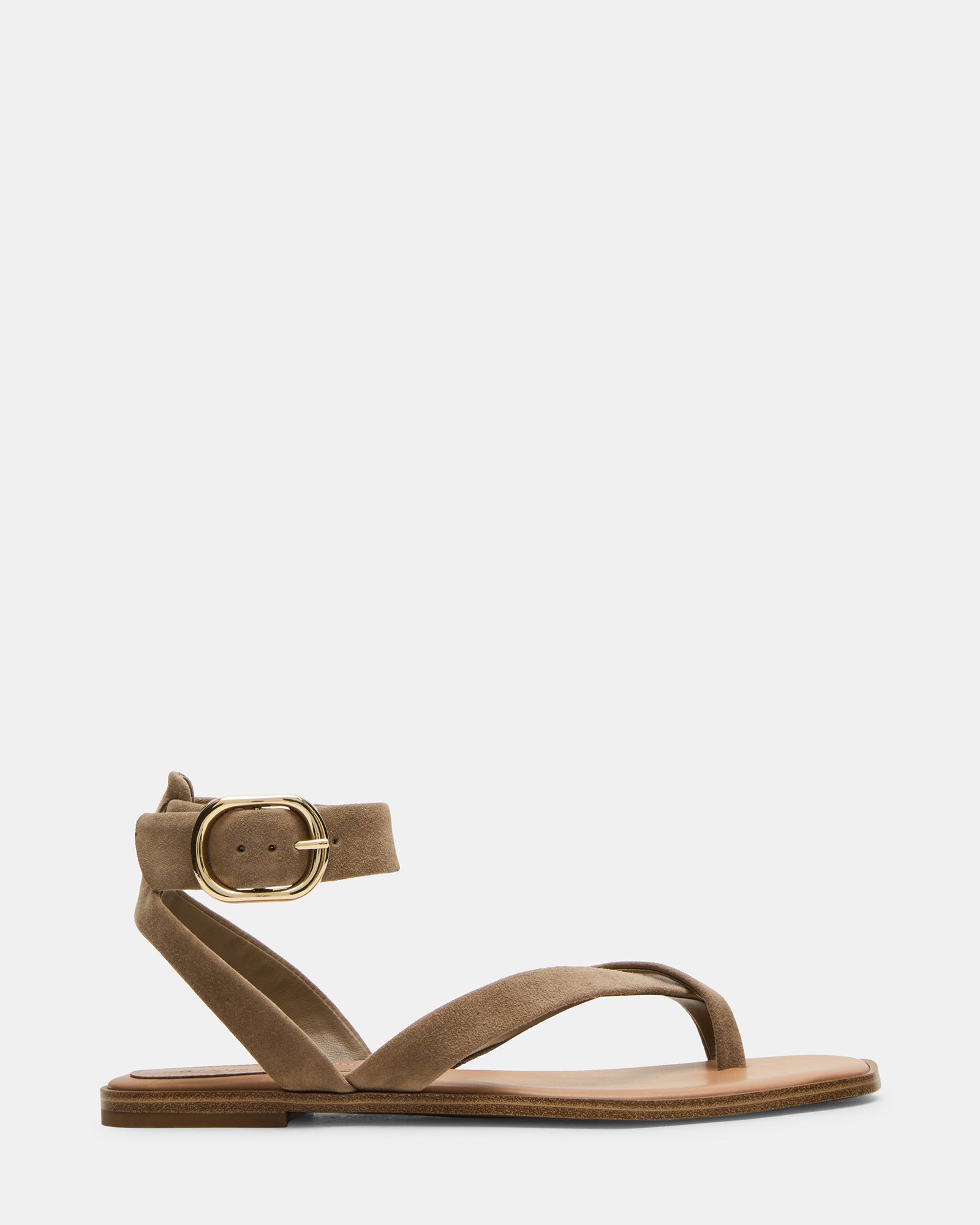 Top-down view of taupe platform sandals styled with cropped denim on a city sidewalk