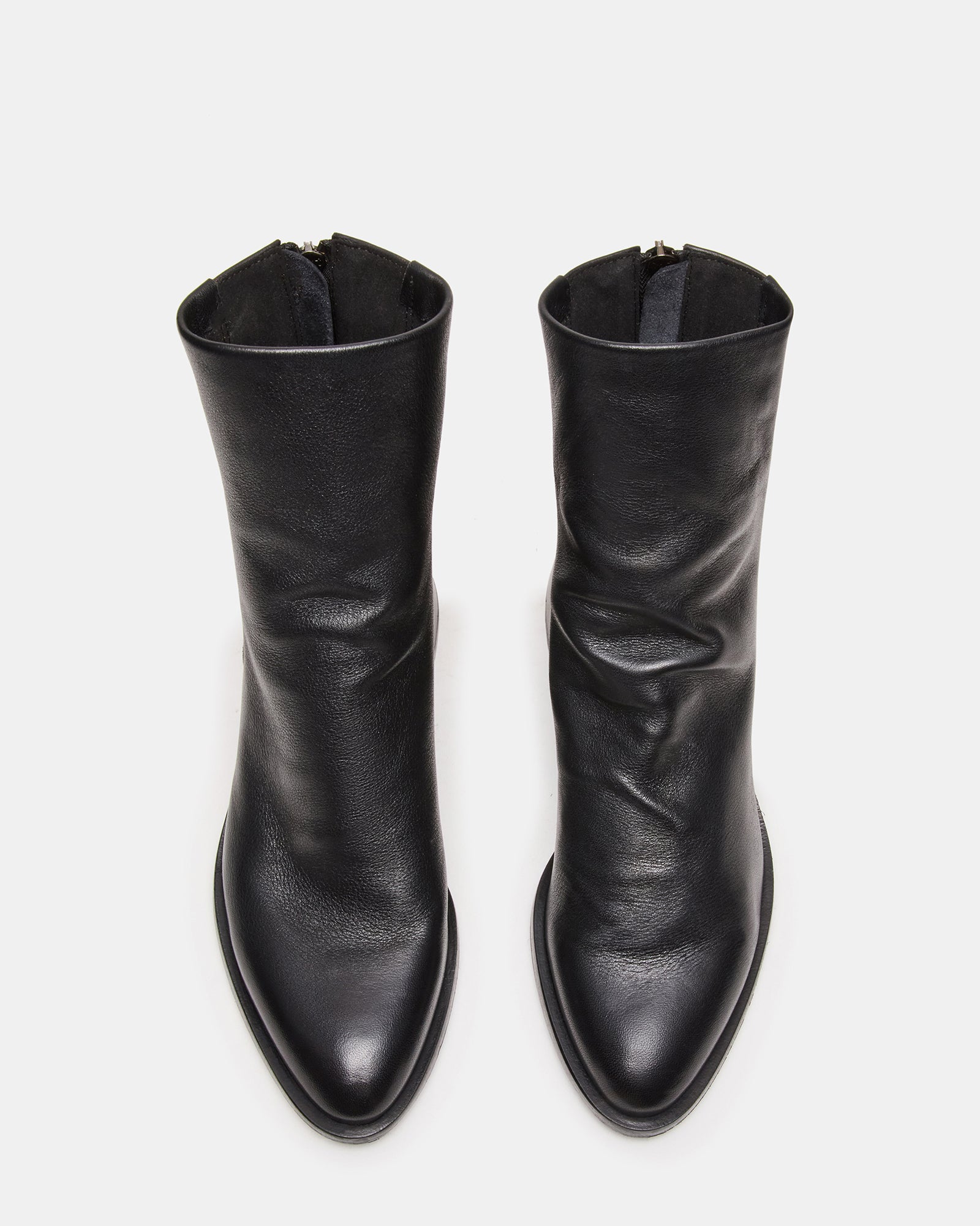 Top-down view of Nebula leather booties showing pointed toe design.