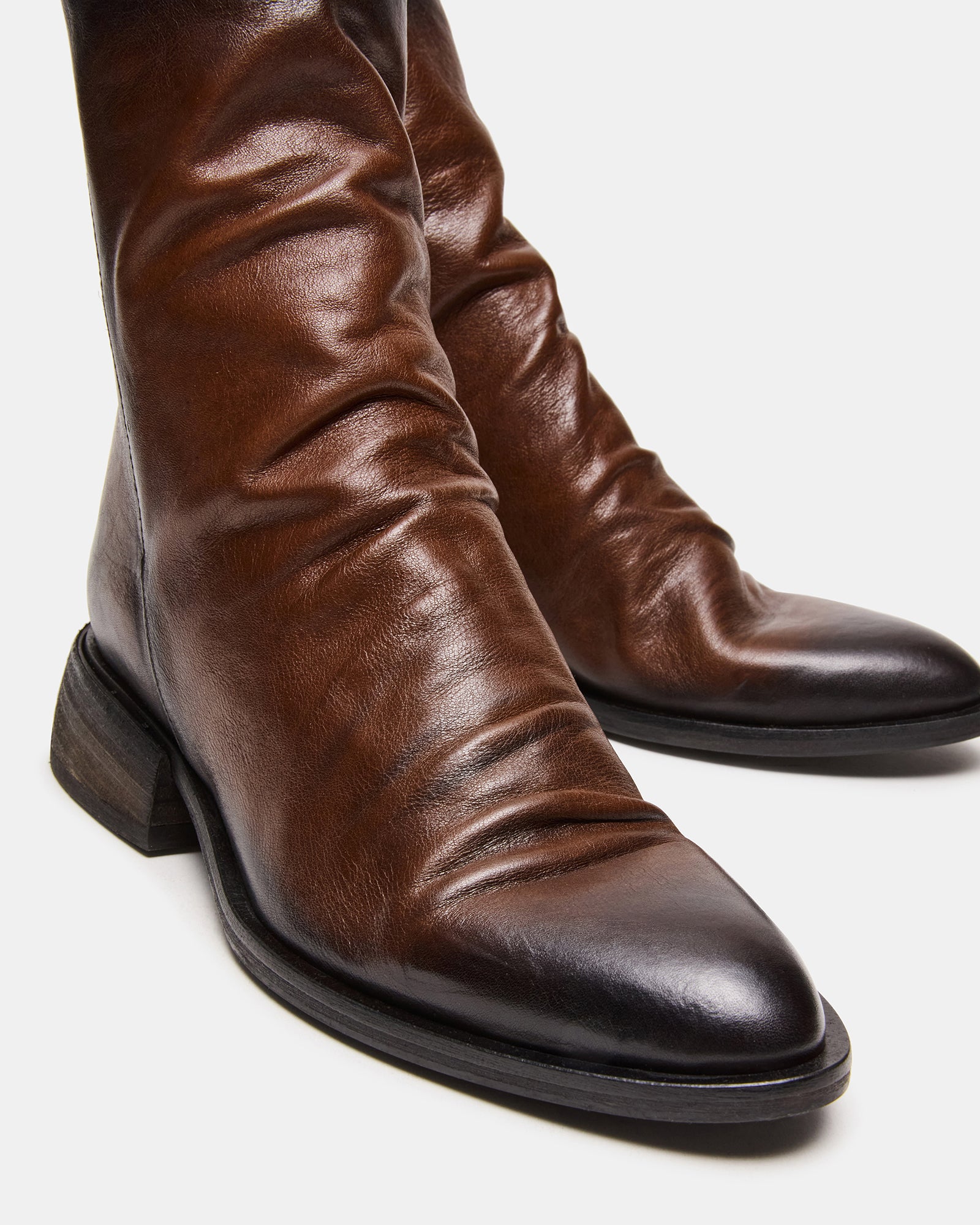 Brown ankle boots styled with jeans for casual fall outfit