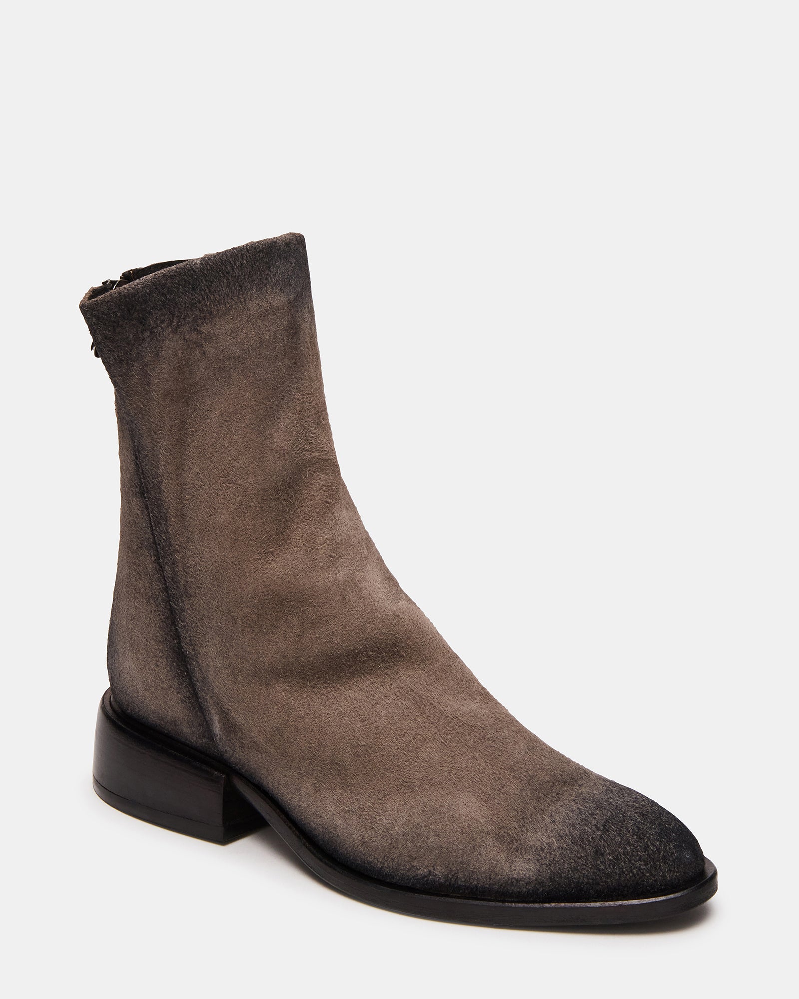 Side view of stylish grey suede boots featuring a sleek silhouette and easy access zip