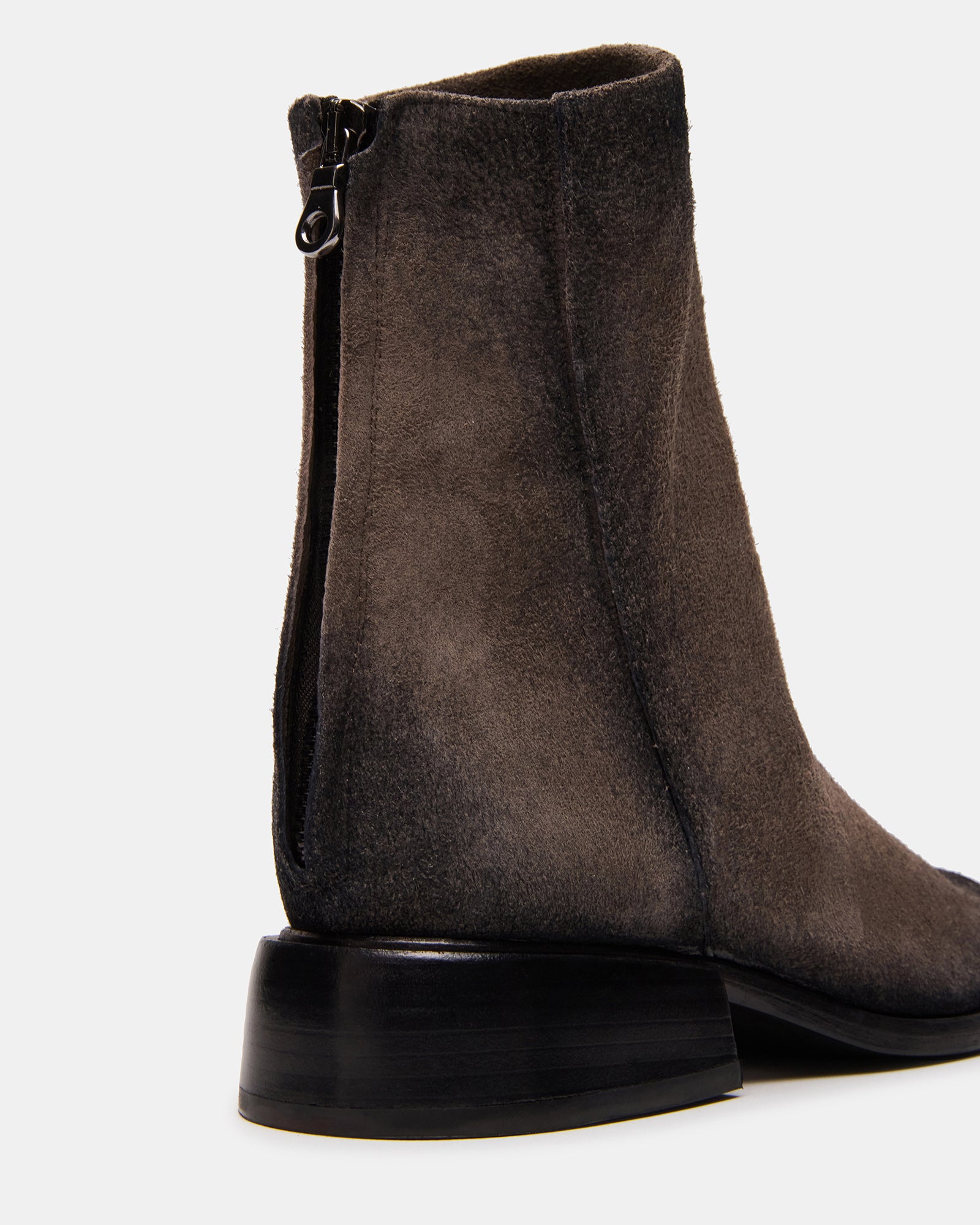 Close-up of the zipper and suede texture on Nebula grey ankle boots