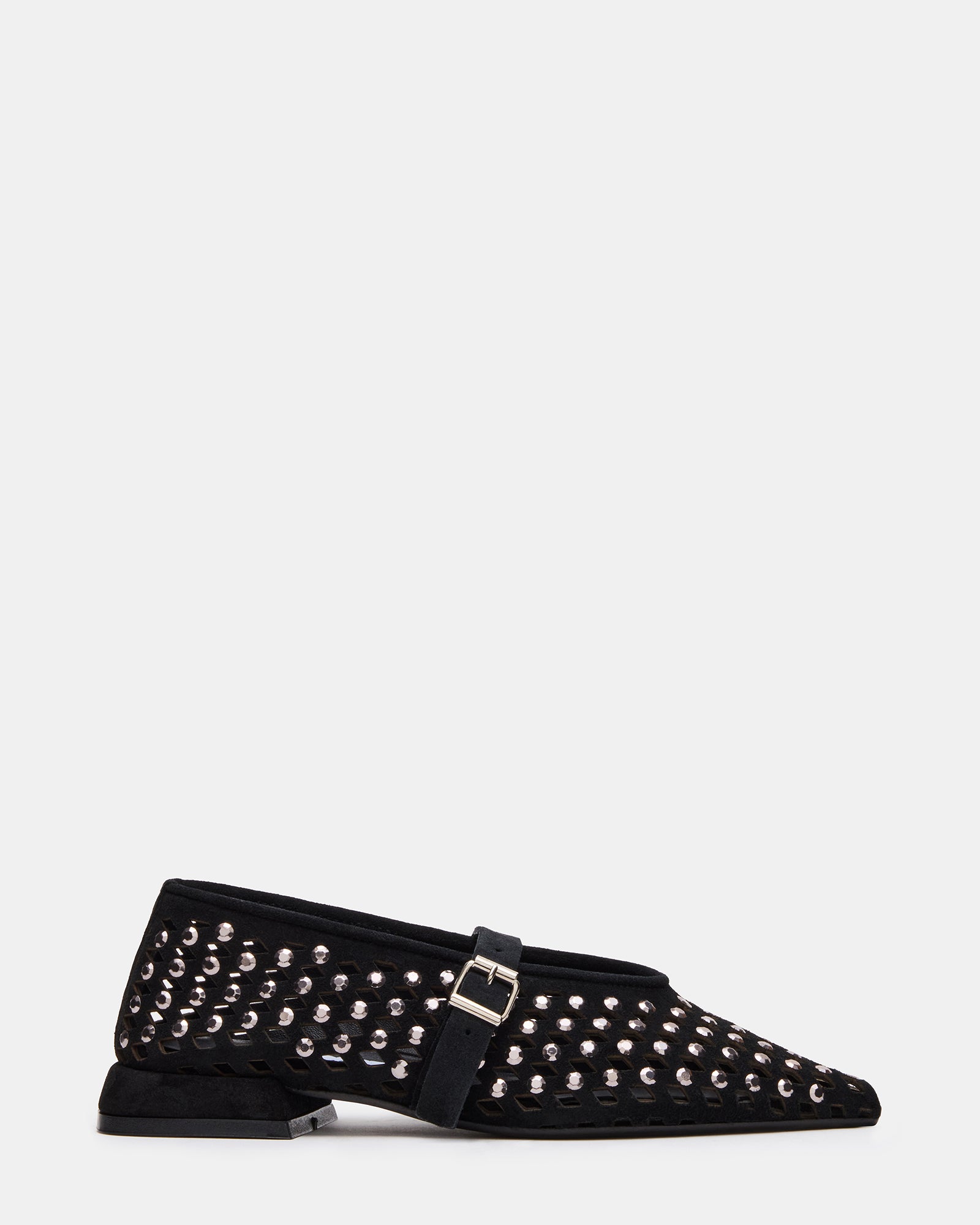 Close-up of black suede ballet flats showing gemstone detail and pointed toe
