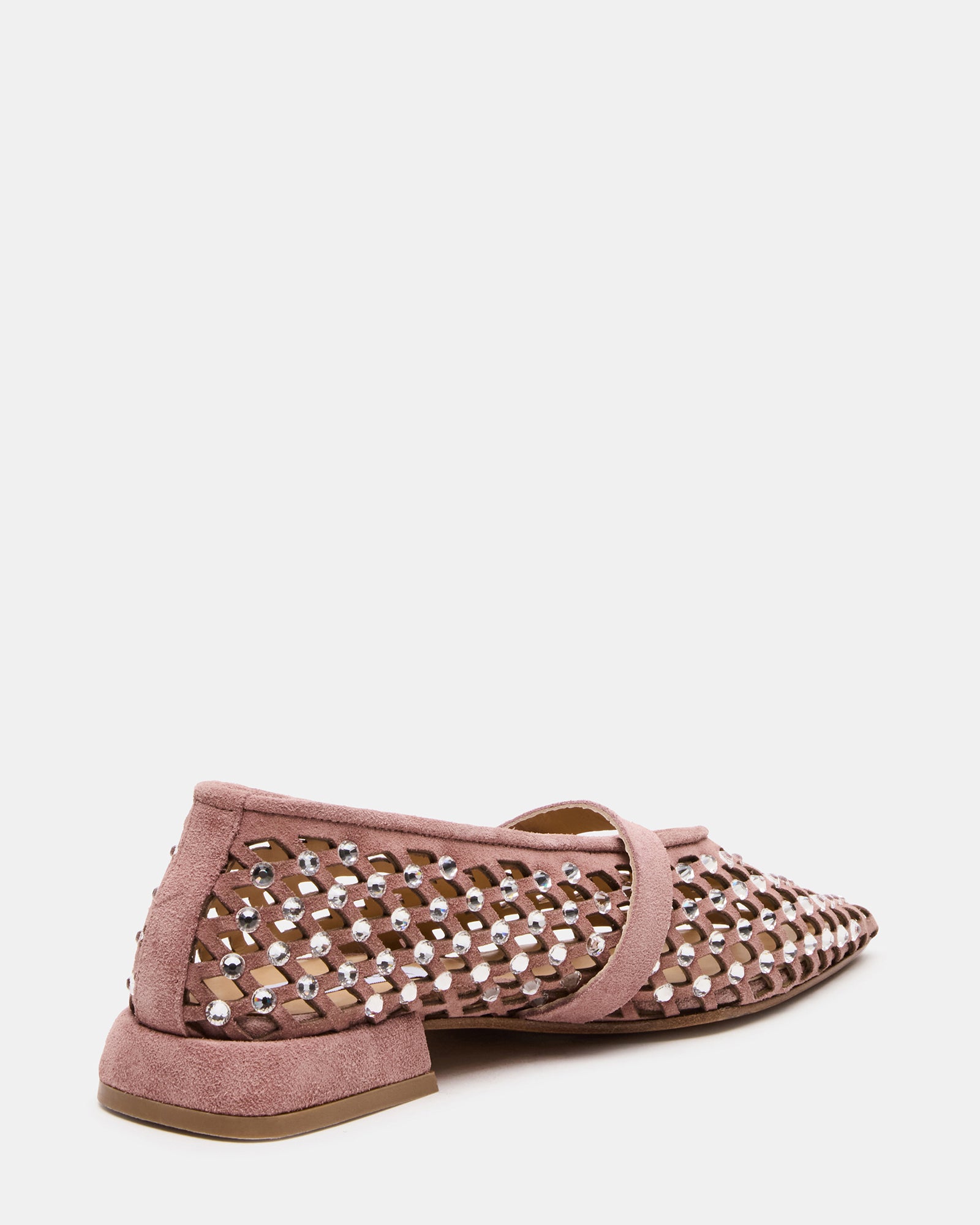 Close-up of pointed toe shoes featuring delicate stone detailing.