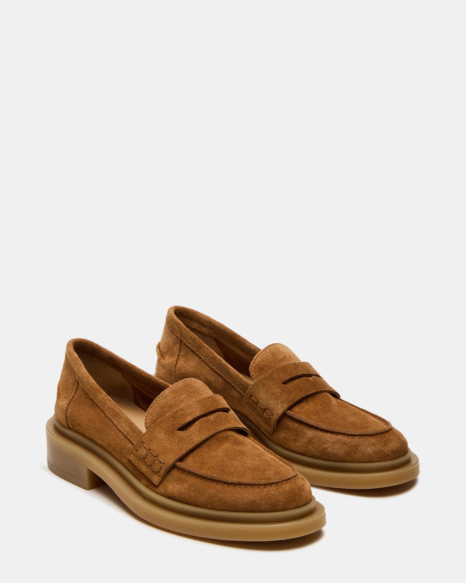 Top-down shot of mens dress loafers paired with navy trousers