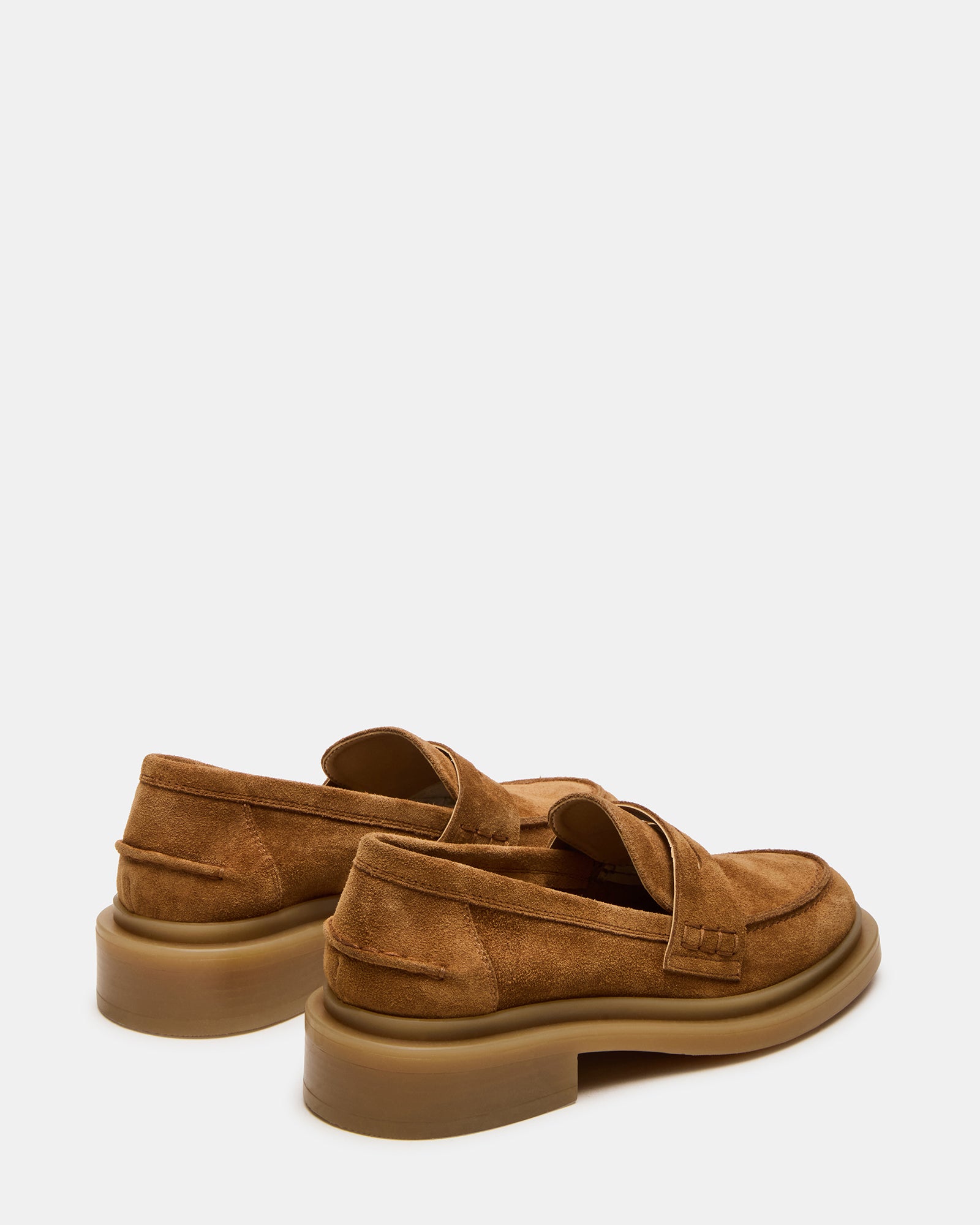 Top-down shot of mens dress loafers paired with navy trousers
