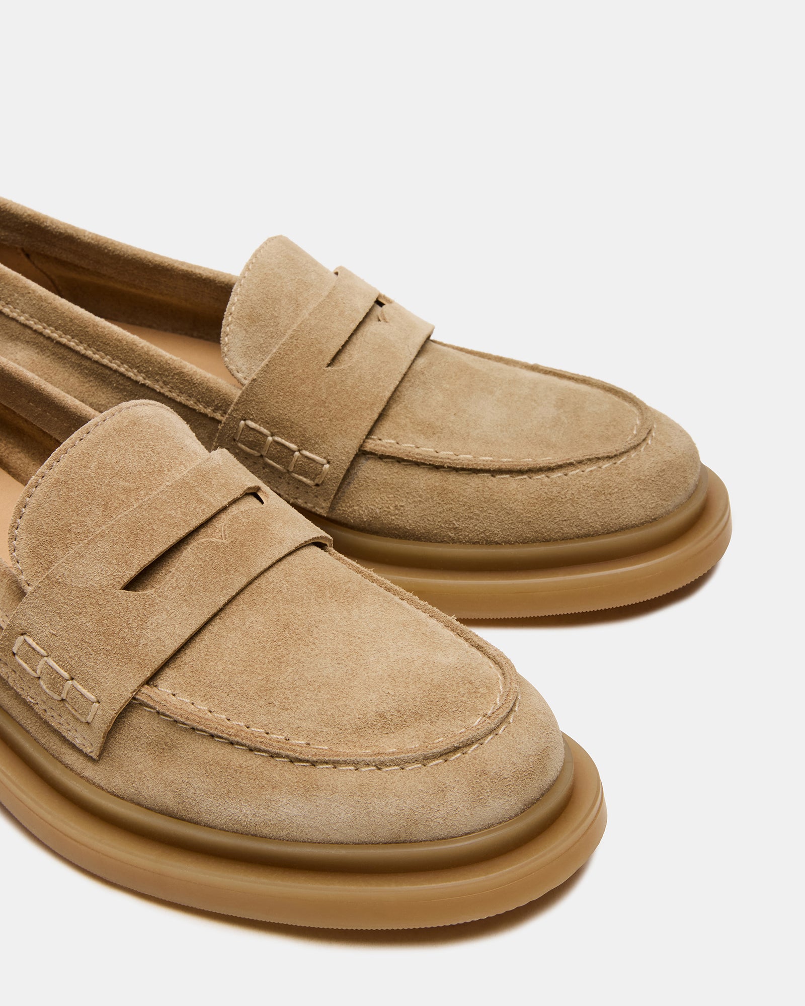 Fashionable mens taupe suede loafers paired with chinos for a casual look