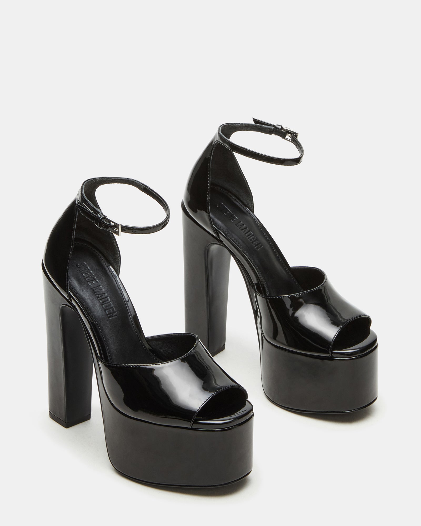 Front view of stylish black patent block heels with square toe design