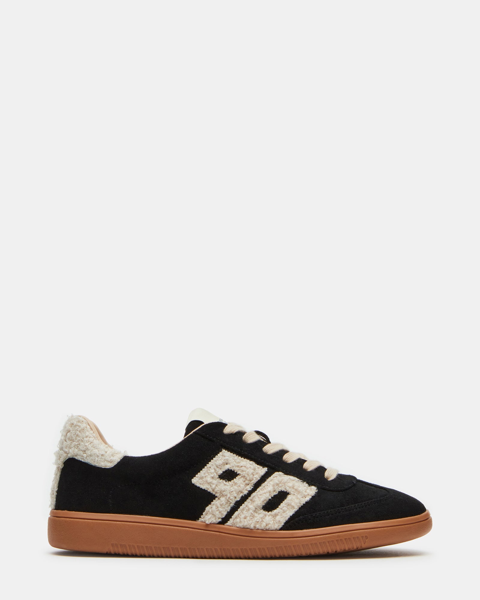 Nineties faux shearling sneakers in a trendy urban setting.