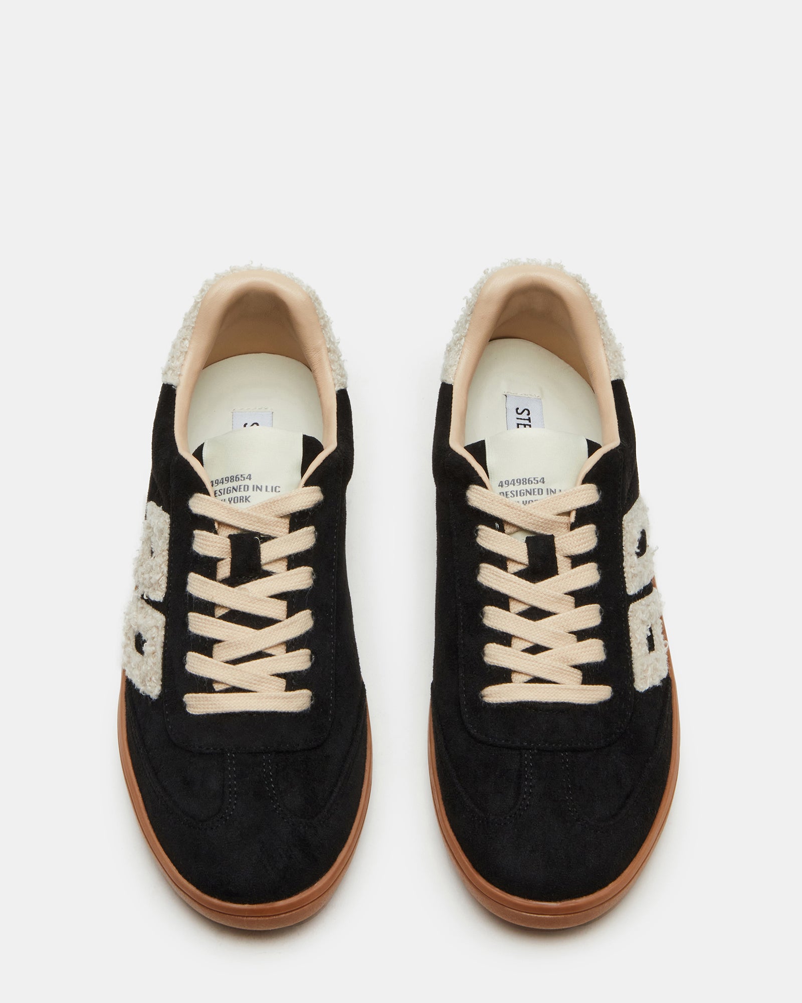 Nineties faux shearling sneakers in a trendy urban setting.