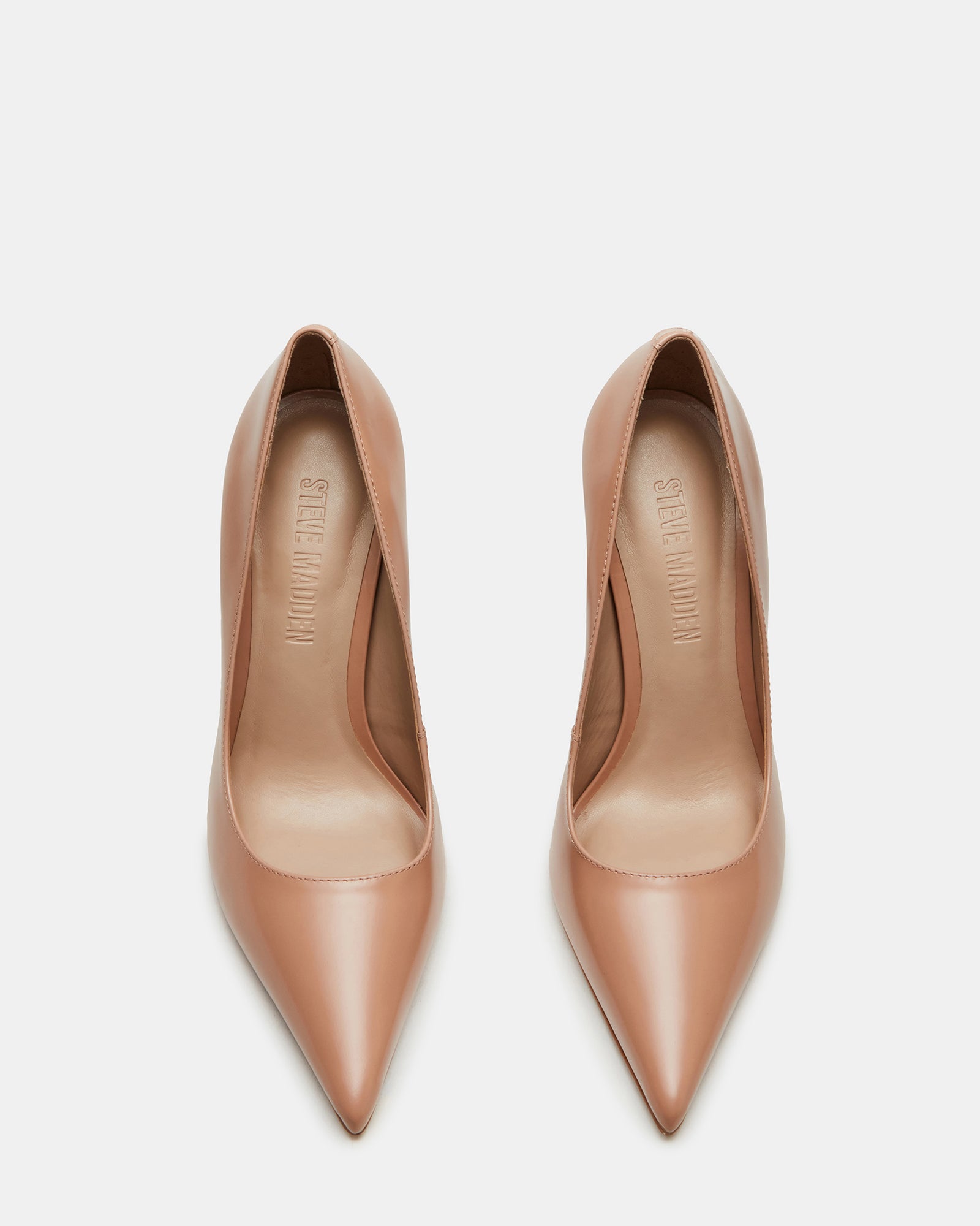 Pair of pumps positioned near travel essentials, ideal for NYC weekend getaways