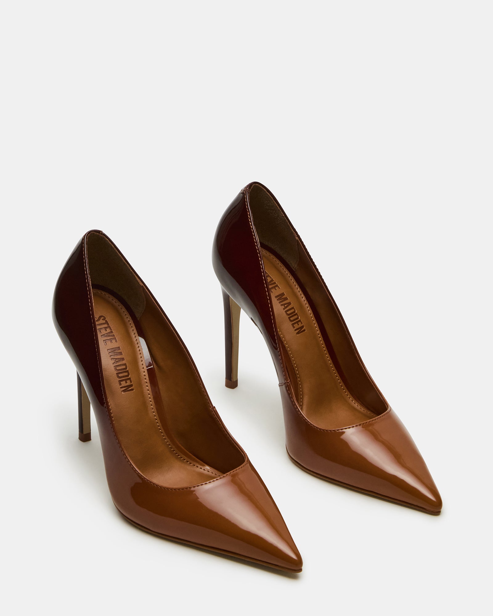 Side view of light pink high heel shoes styled with an evening dress