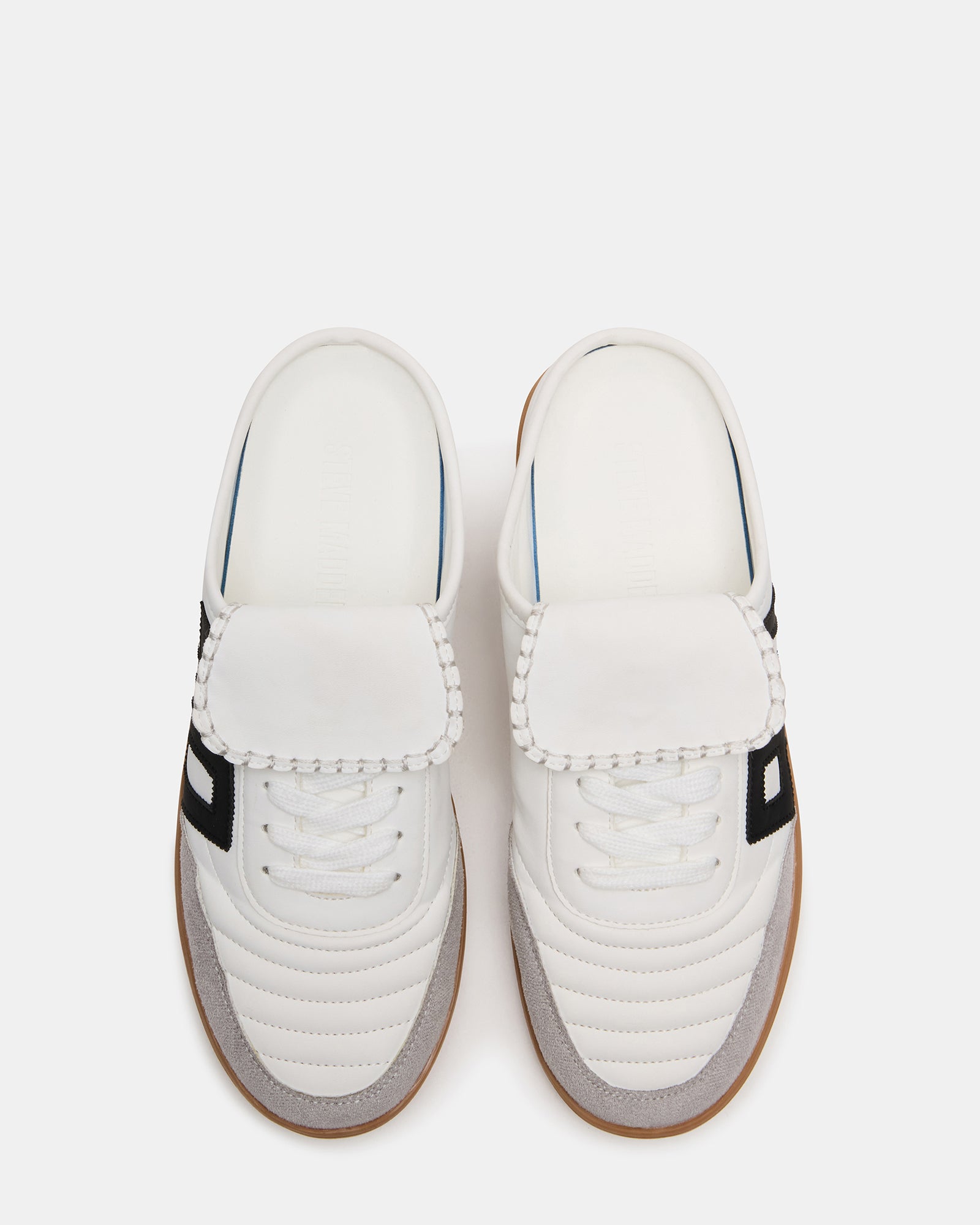 Nostalgic white slip-on sneakers showcasing lace-up design.