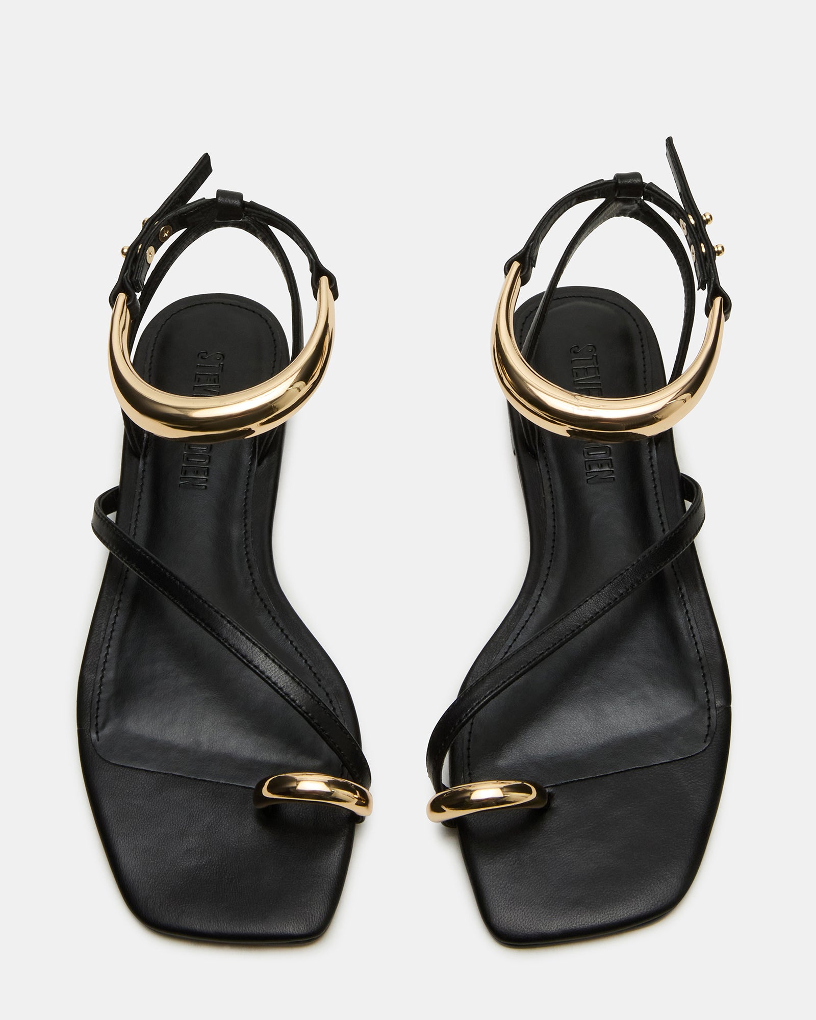 Close-up of the gold hardware ankle strap on Odyssey leather sandals for women