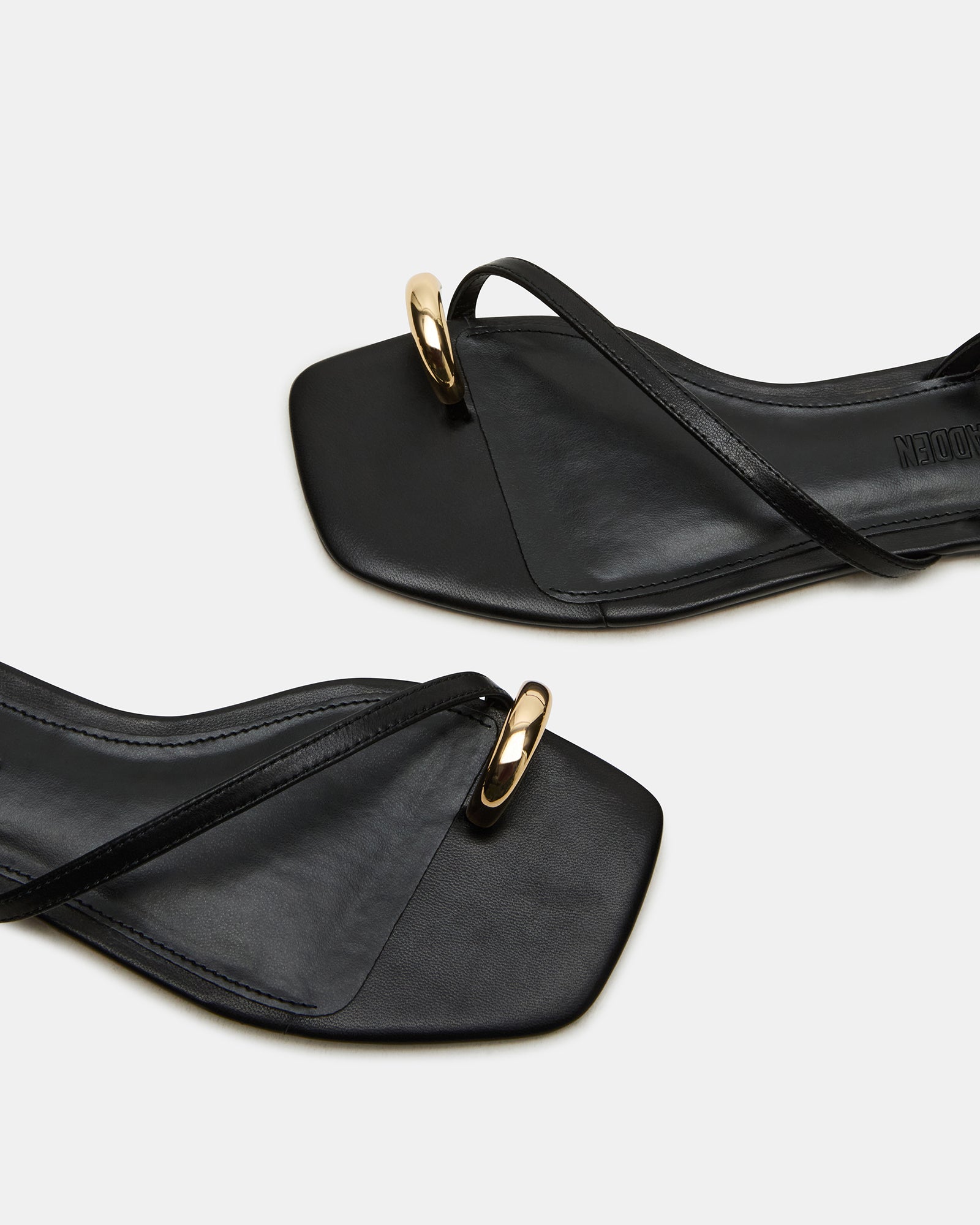 Side view of Odyssey black leather sandals with ankle strap and square-toe shape