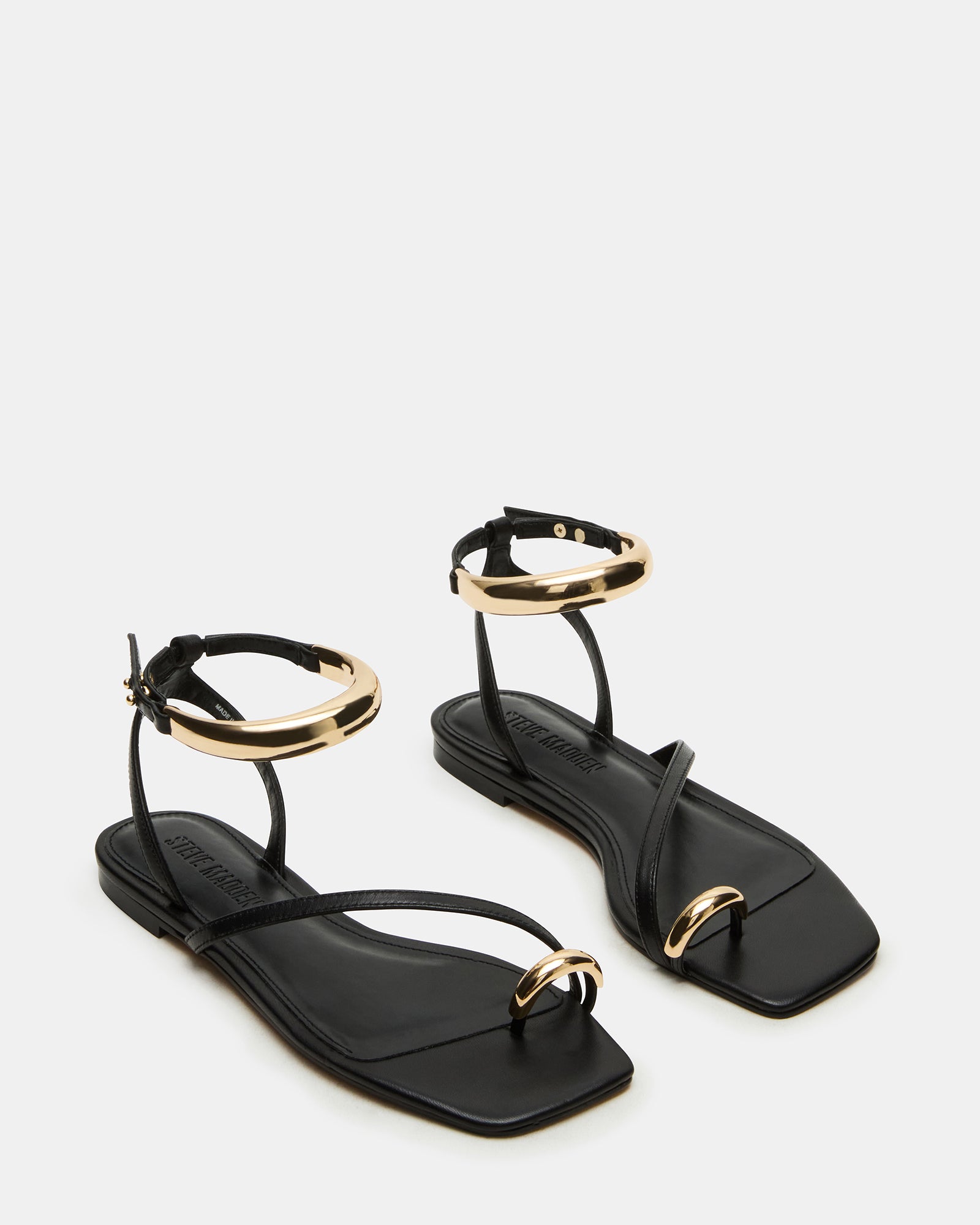 Fashionable Odyssey black leather sandals styled with casual summer outfit