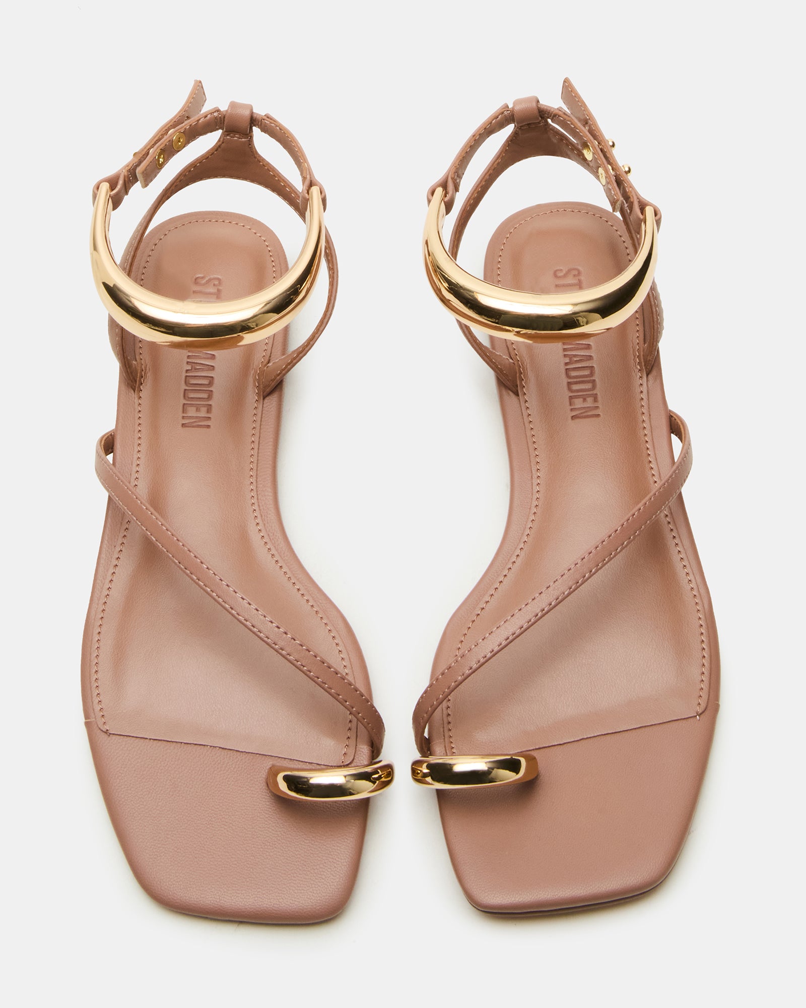 Close-up of the gold hardware ankle strap on ODYSSEY Mocha sandals