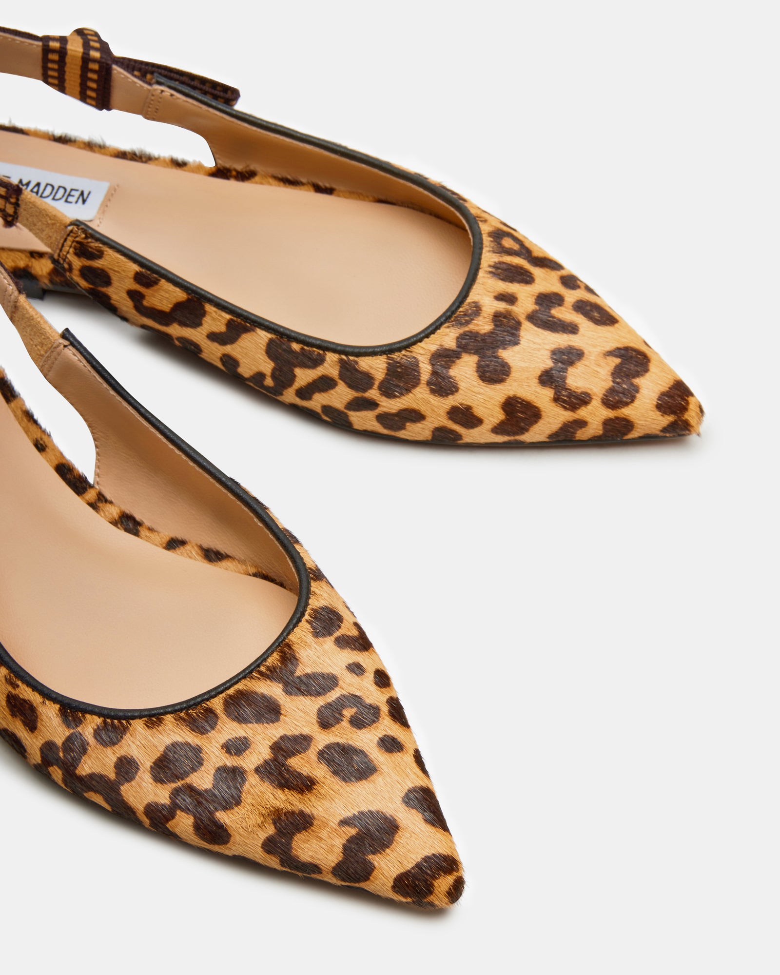 Side view of Olsen leopard print flats showcasing the slingback design.