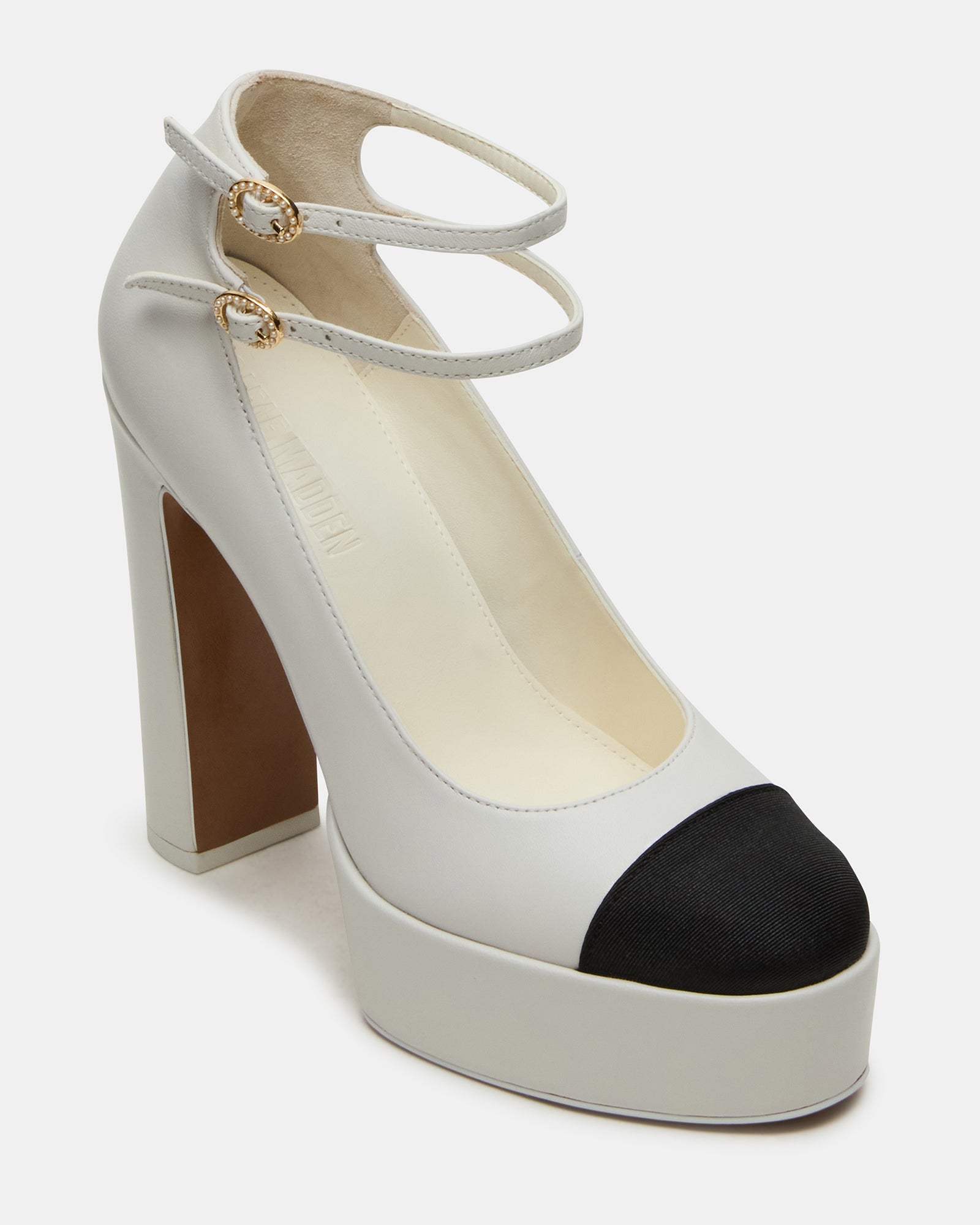 Side profile of block heel shoes sandals worn at a Miami brunch