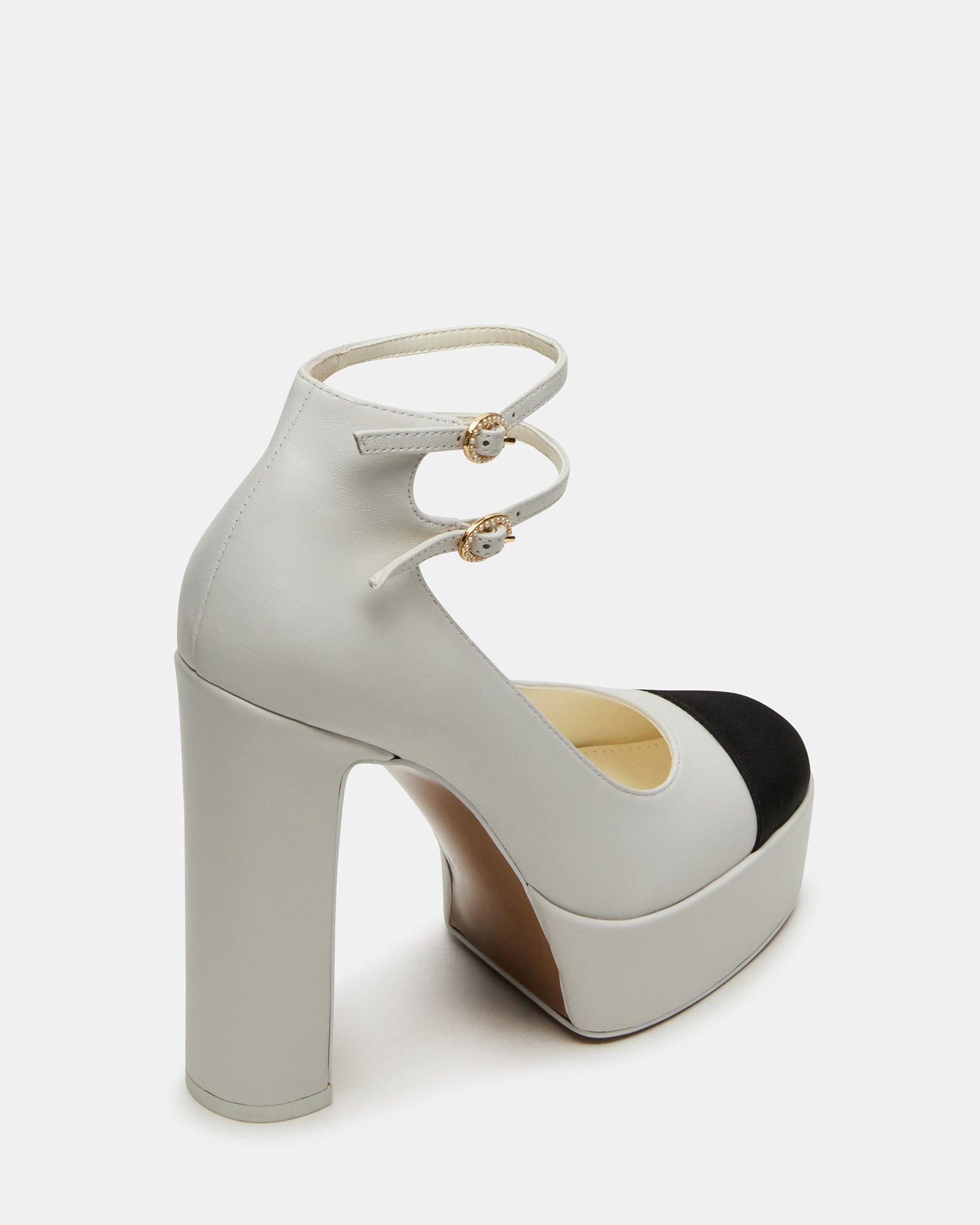 Side profile of block heel shoes sandals worn at a Miami brunch