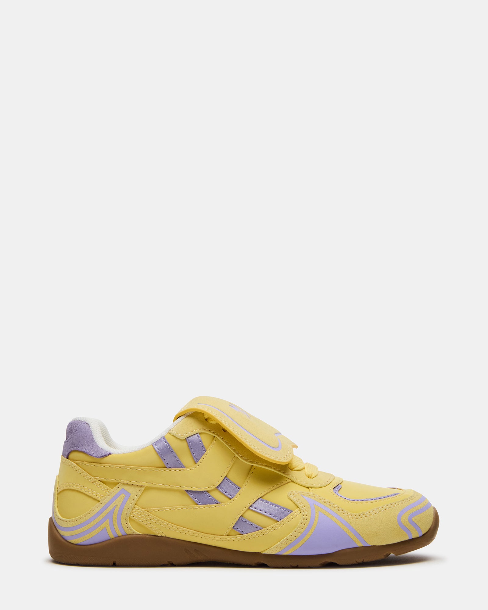 Optimus Yellow Multi sneakers paired with jeans for a casual look.