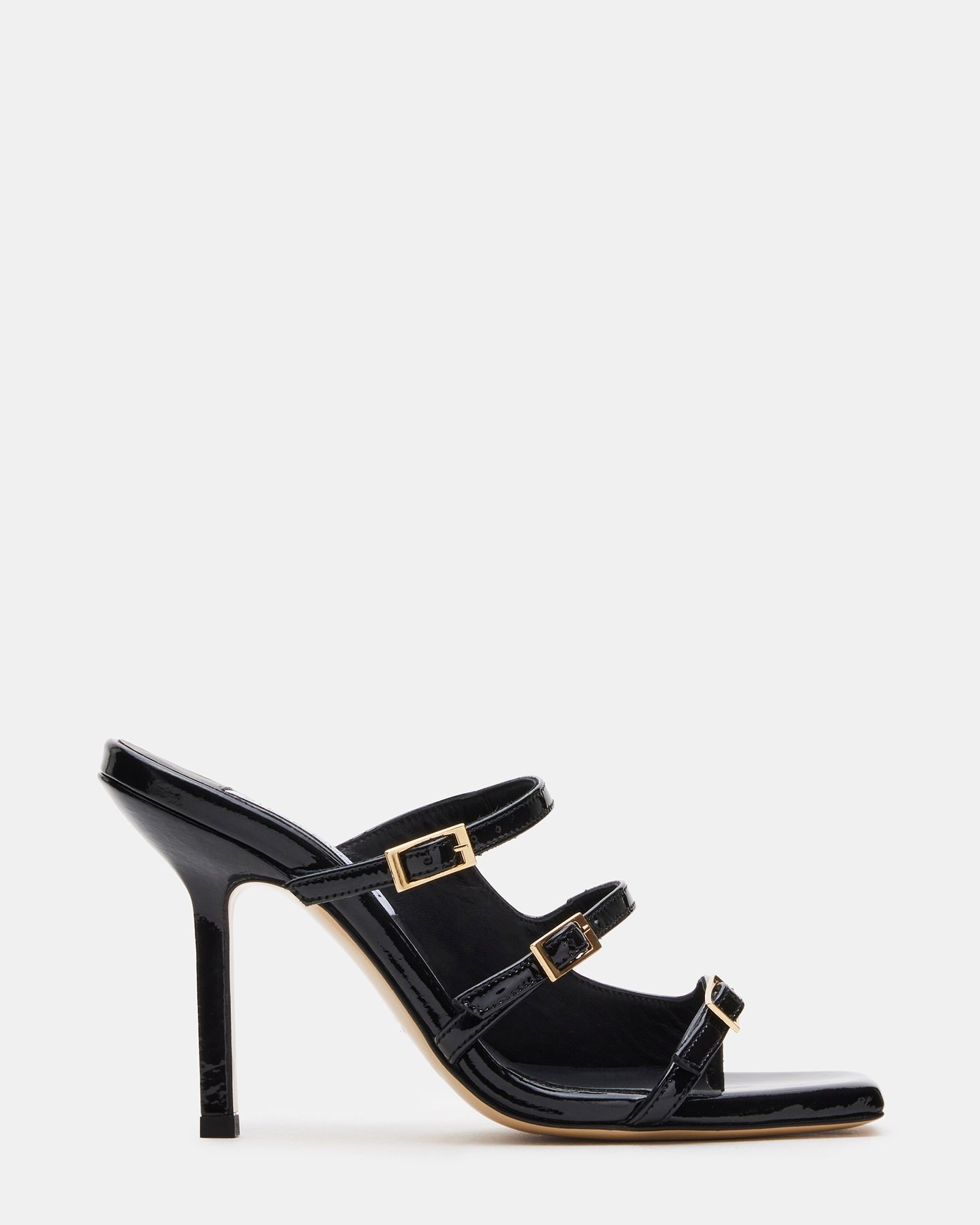 Side view of black leather mule heels with strappy detail