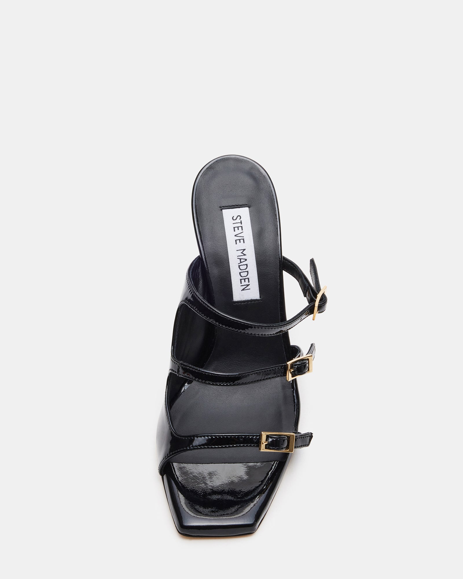 Side view of black leather mule heels with strappy detail