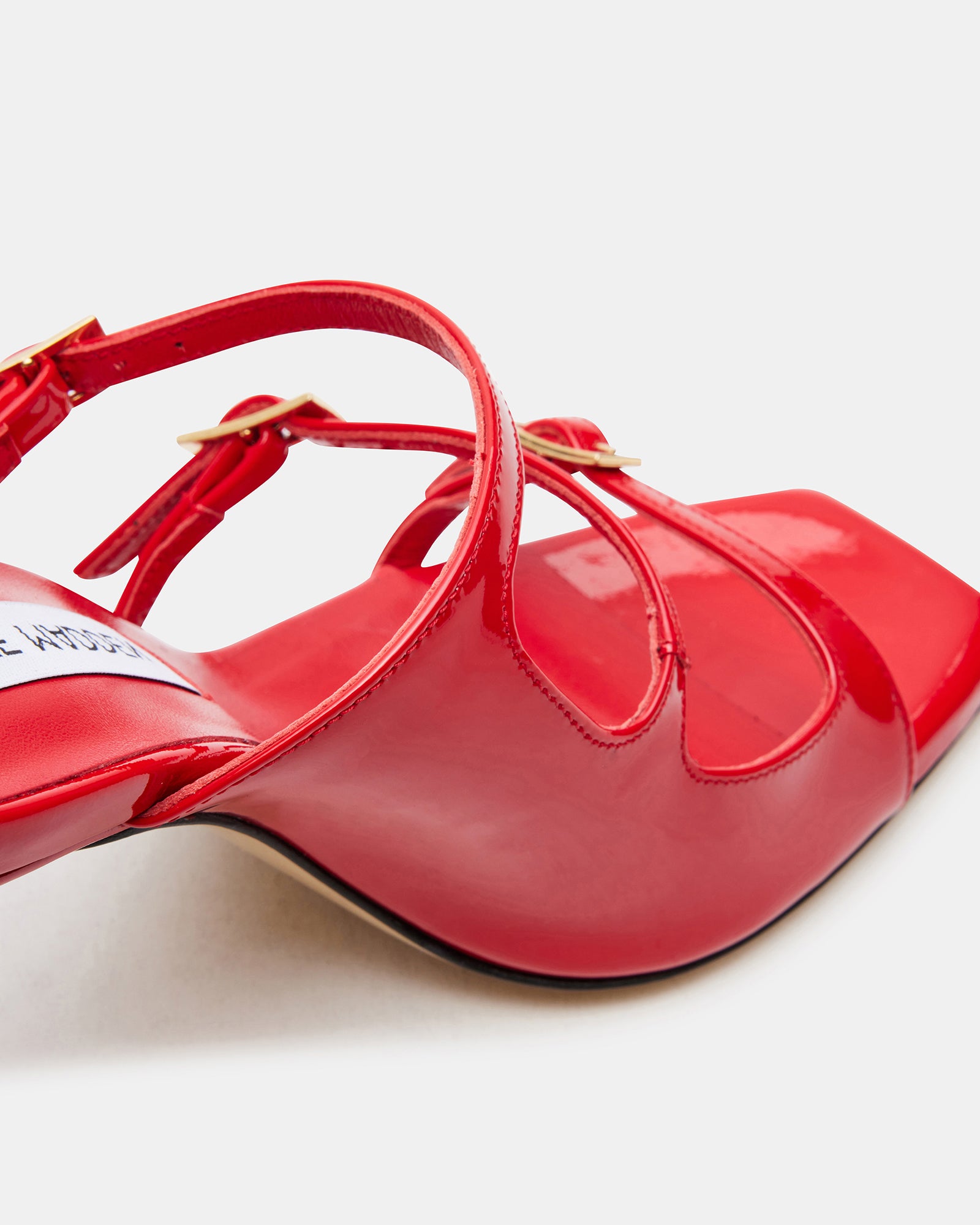 Woman walking confidently in luxury mule heels at city event